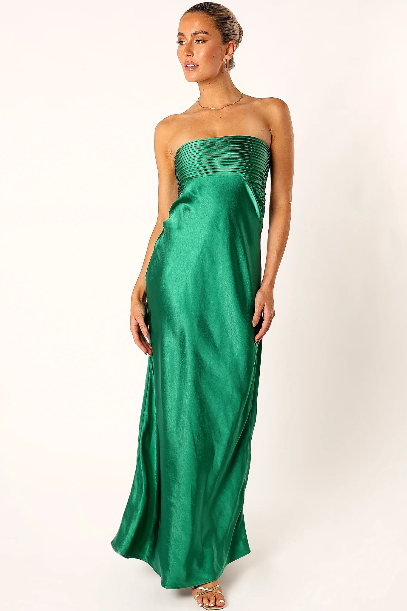 Invisible zip closure on an emerald green maxi dress