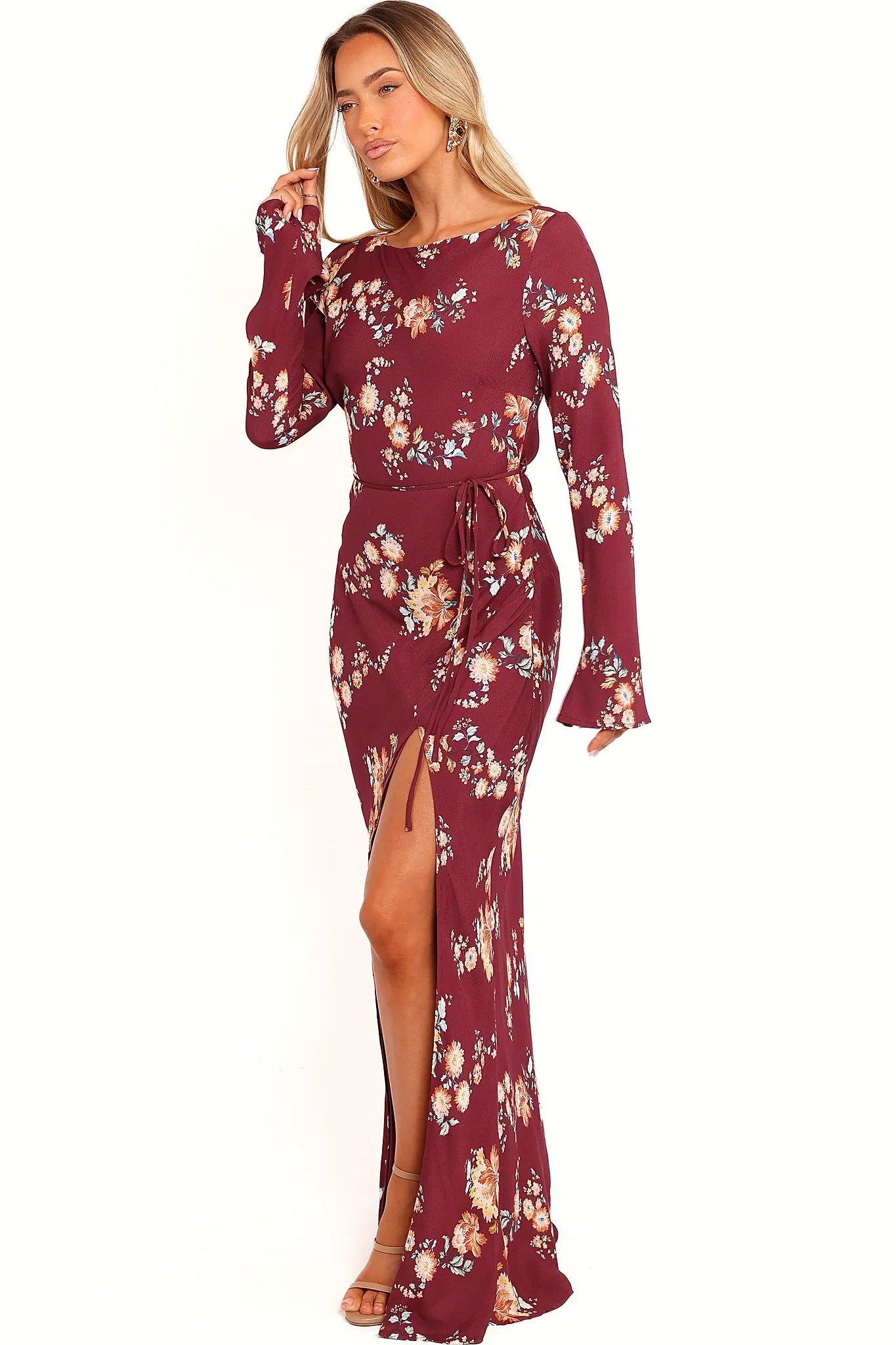Full length view of a berry floral maxi dress with a front split
