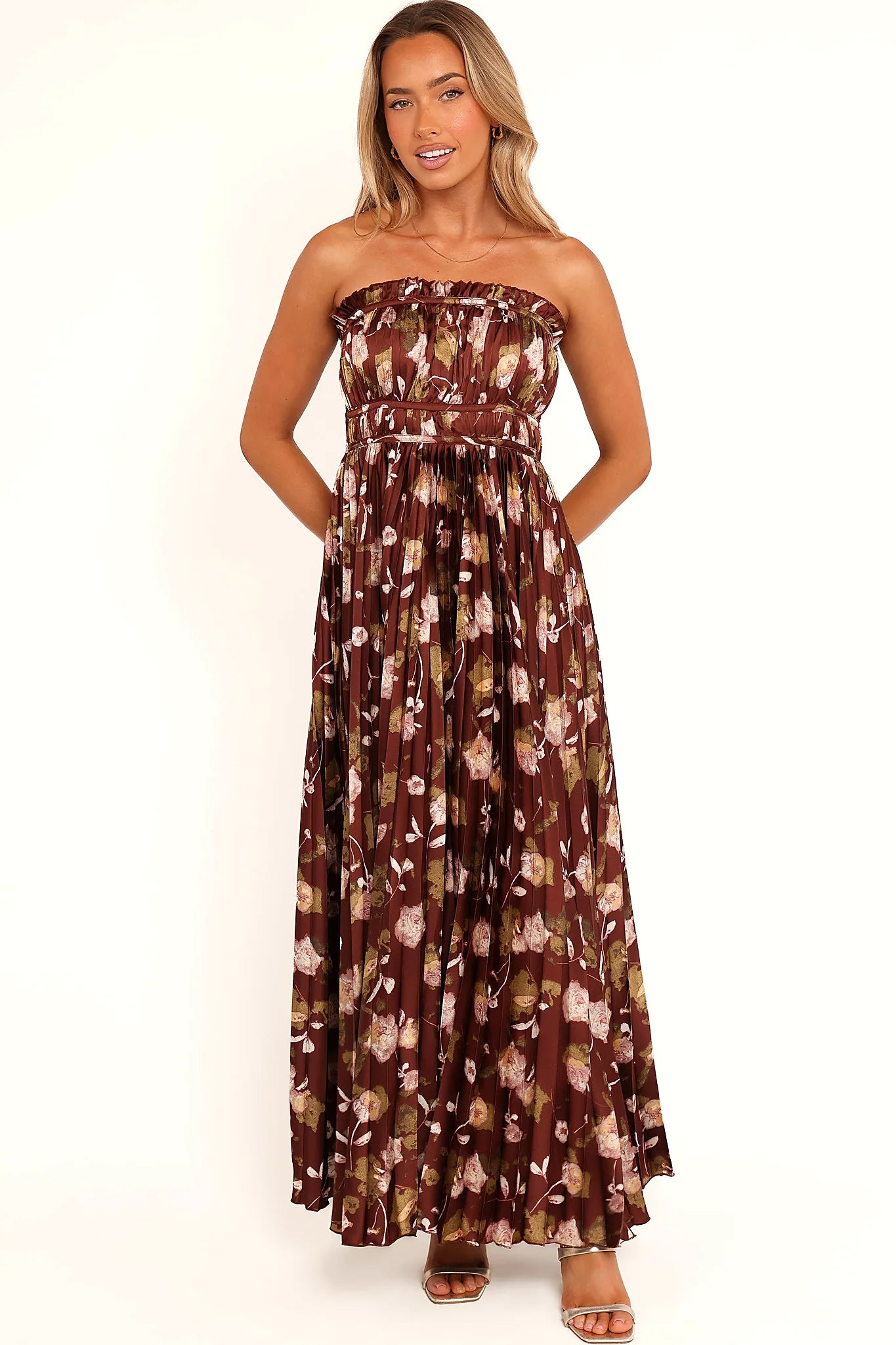 Fine pleats running through a brown floral maxi dress