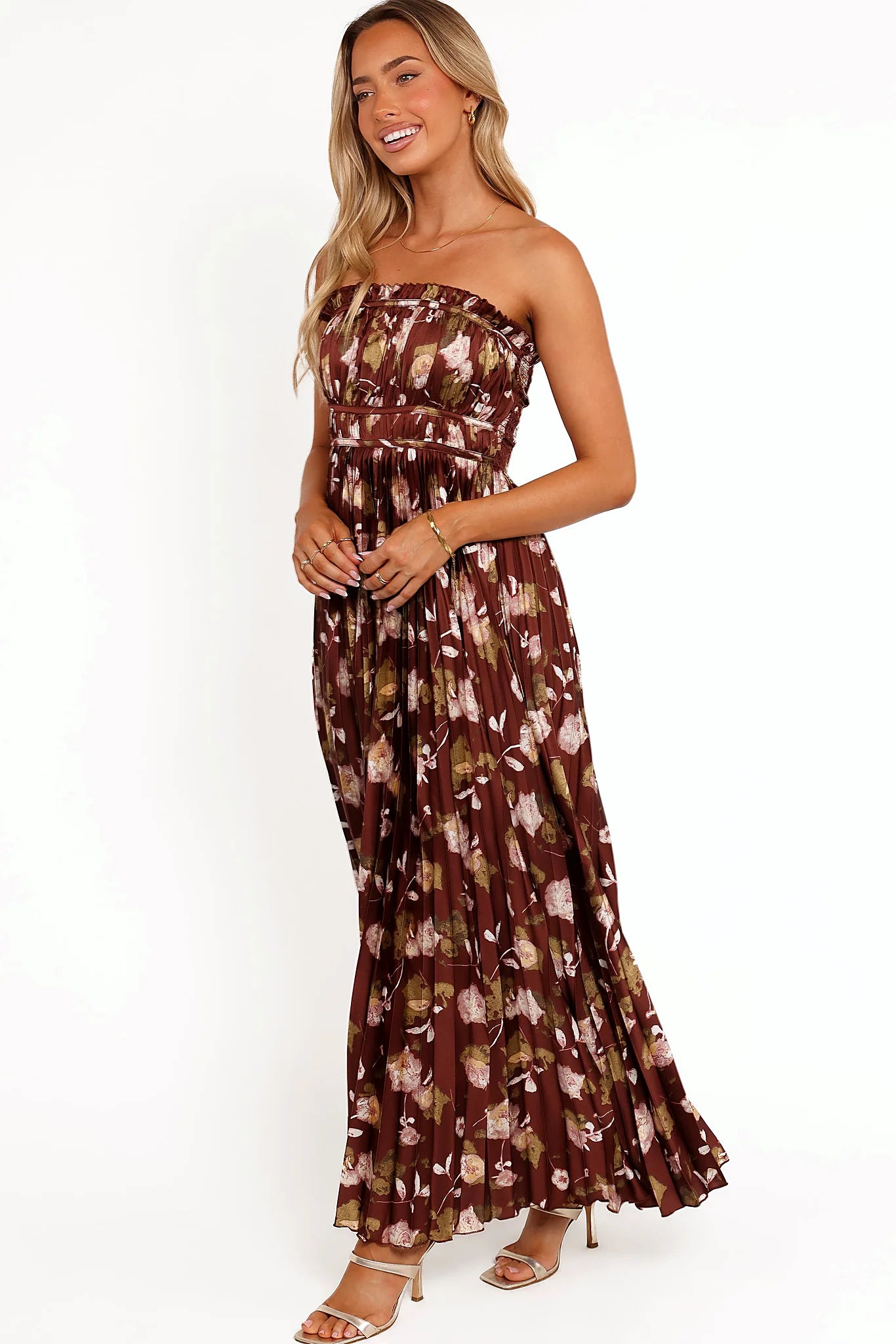 Full length view of a brown floral satin maxi dress