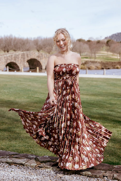 Brown floral strapless satin maxi dress with a straight neckline
