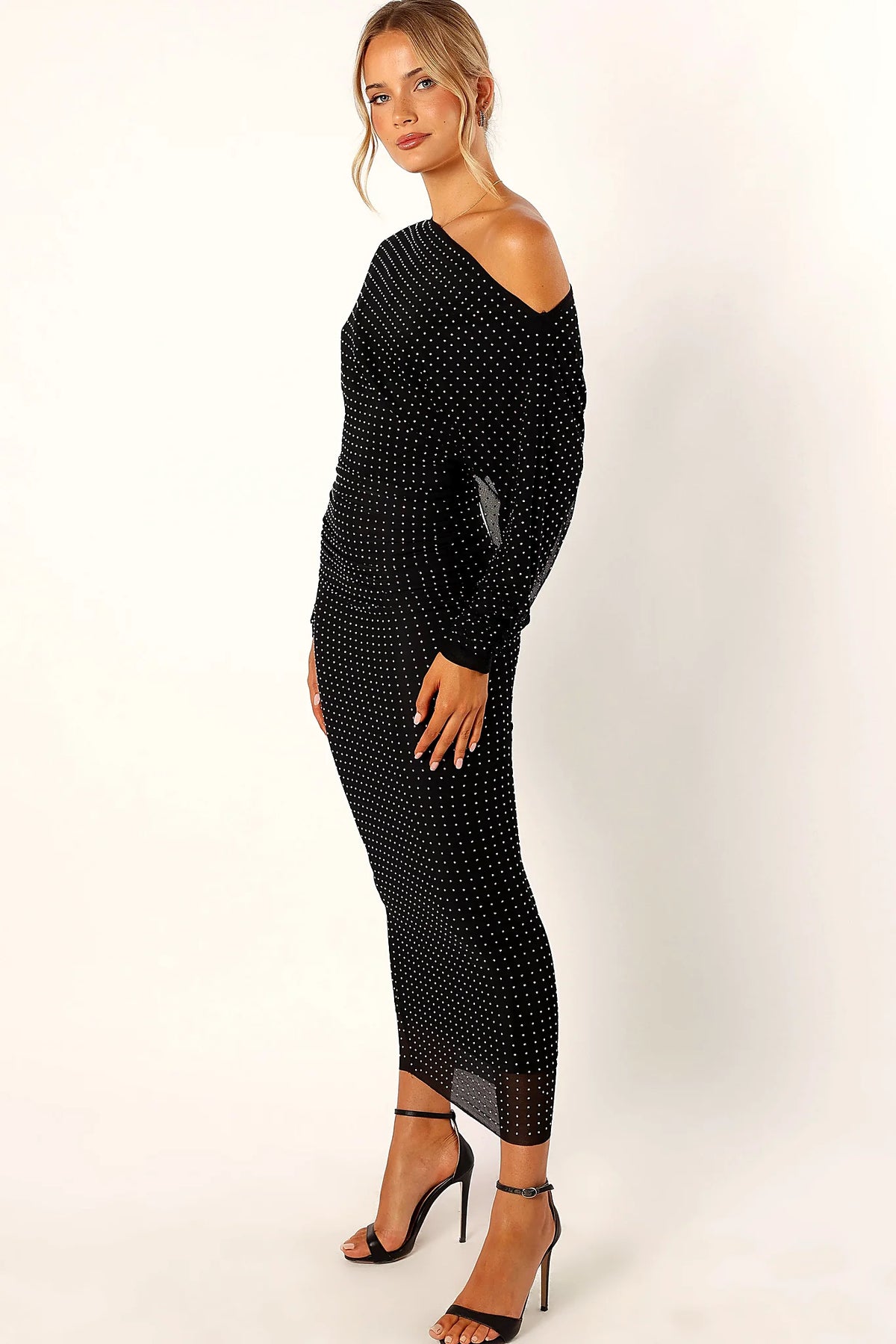 Long sleeve on a black embellished midi dress
