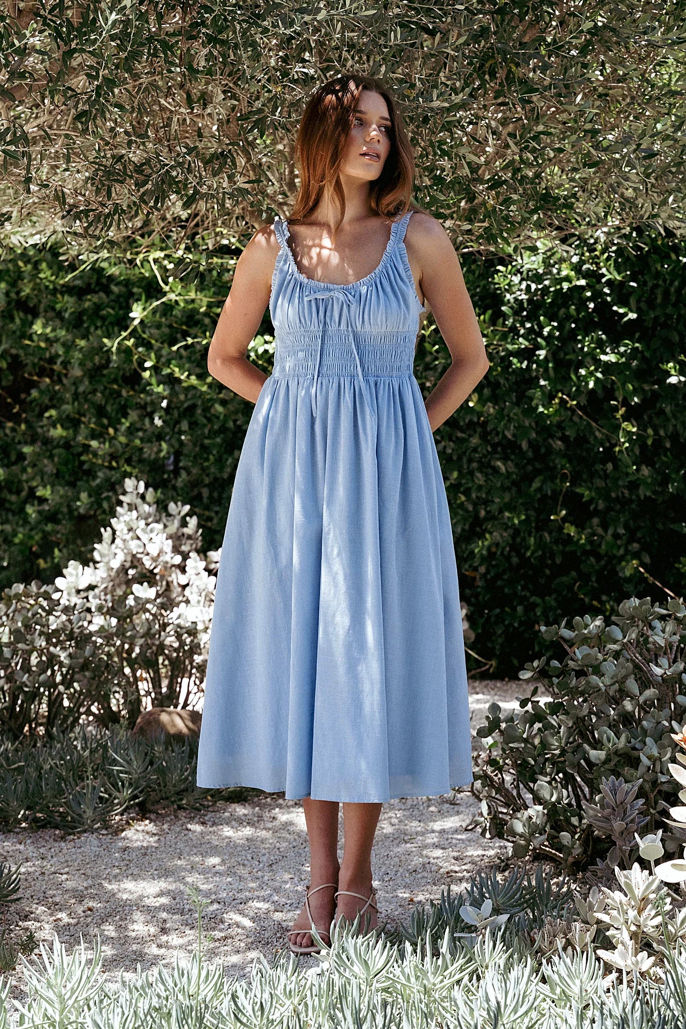 Pale blue cotton midi dress with a round neckline and bust tie