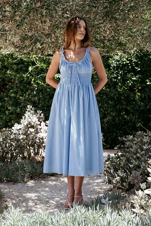 Pale blue cotton midi dress with a round neckline and bust tie