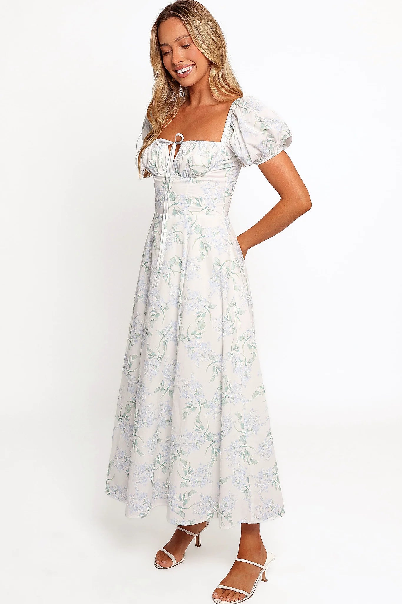 Elasticised cuff on the puff sleeve of a blue midi dress