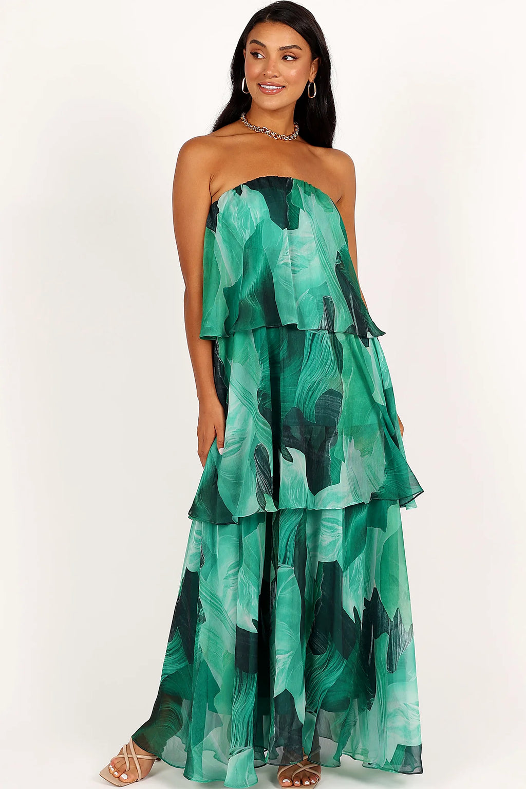 Drop tiered ruffle design on a green floral maxi dress