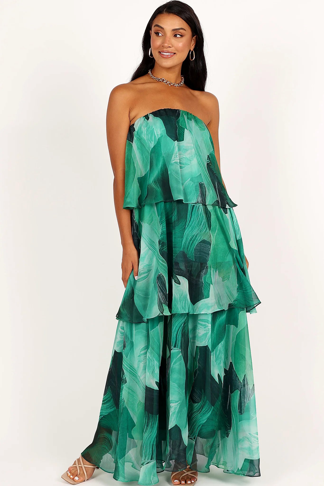 Drop tiered ruffle design on a green floral maxi dress