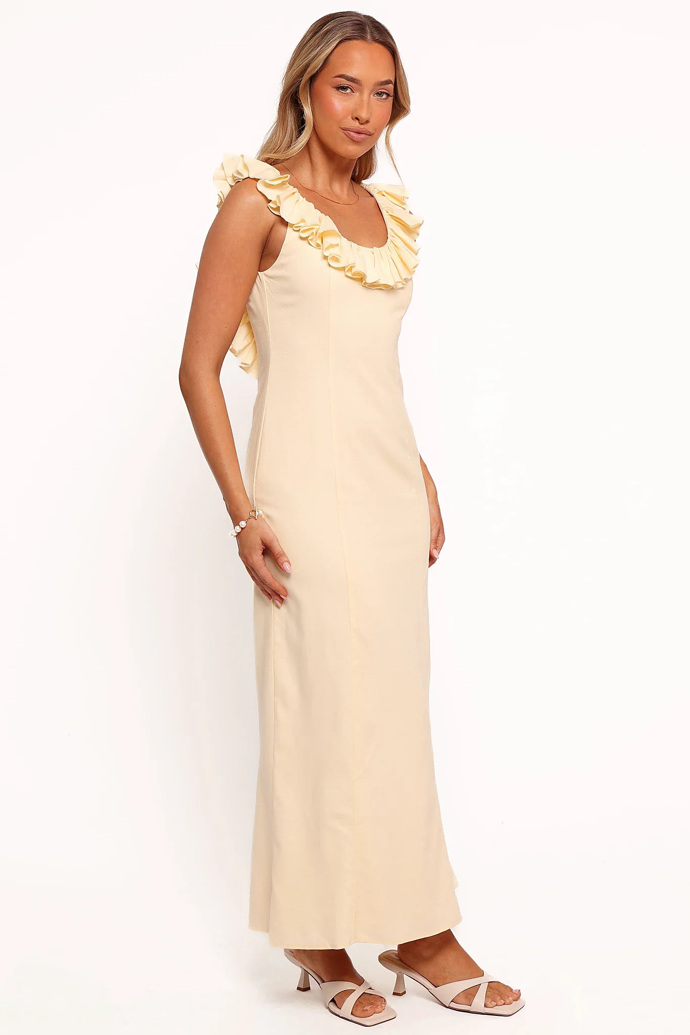 Attached back tie close on a butter yellow maxi dress