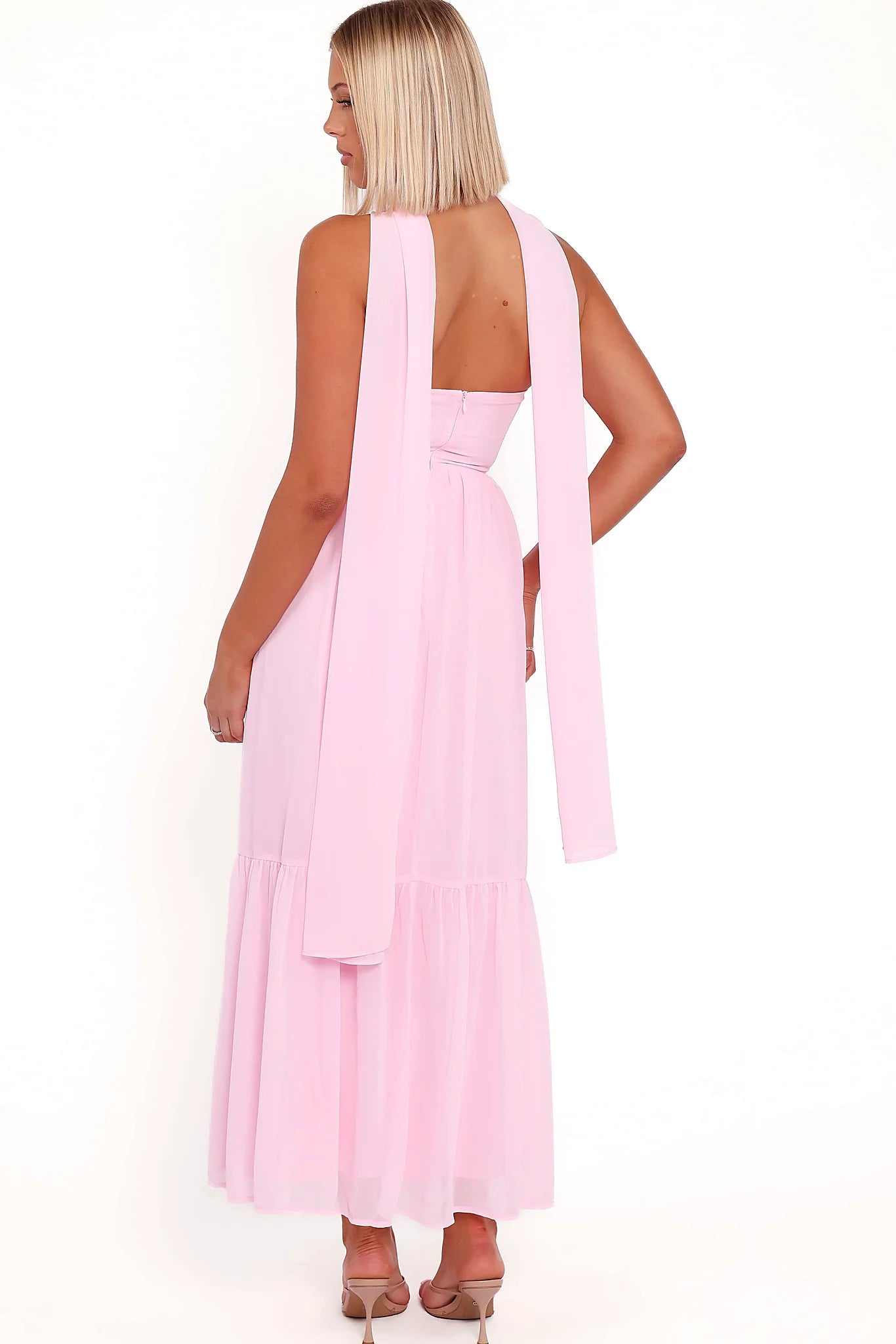 Full length view of a pink bow front maxi dress
