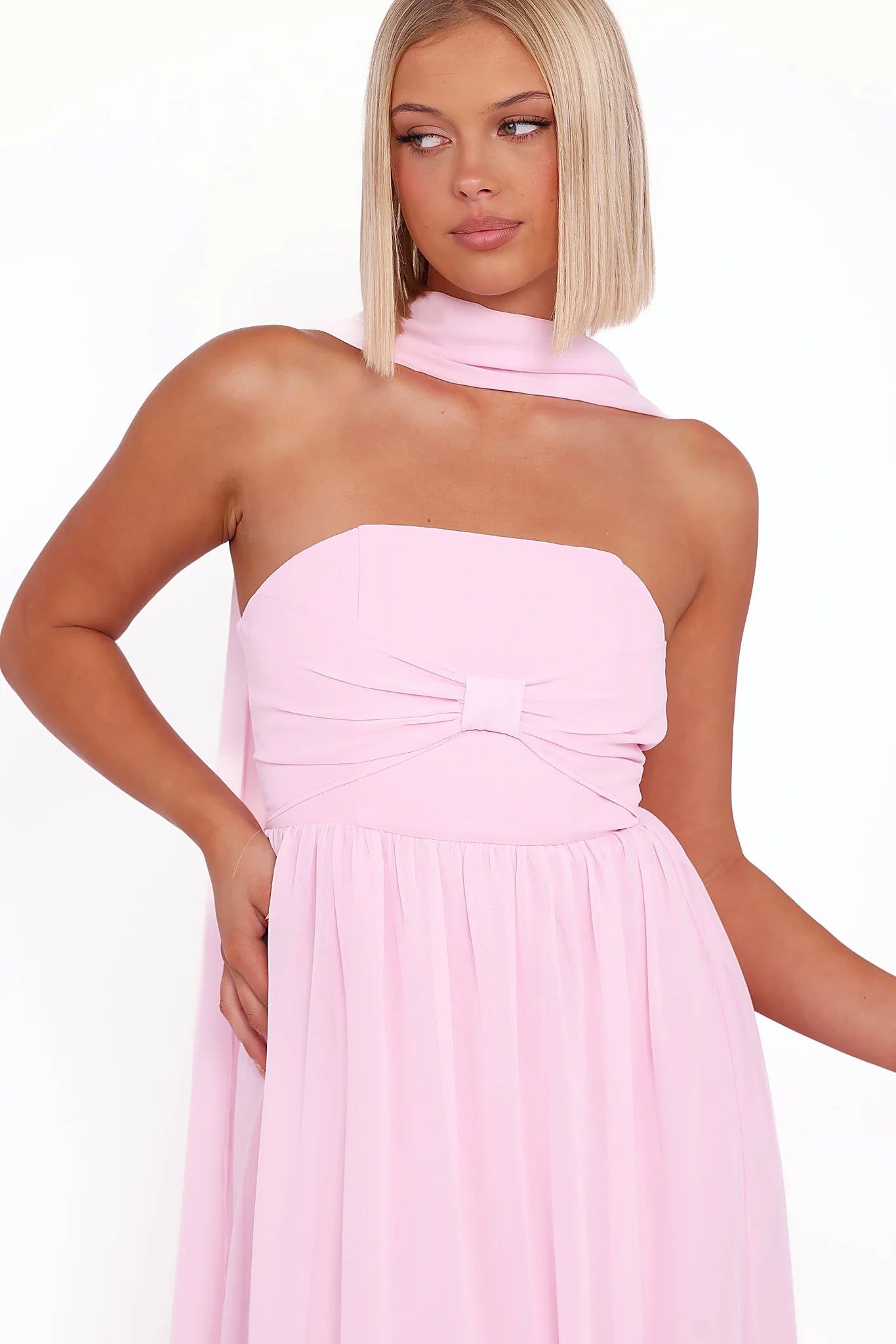 Structured boning in the bodice of a pink maxi dress