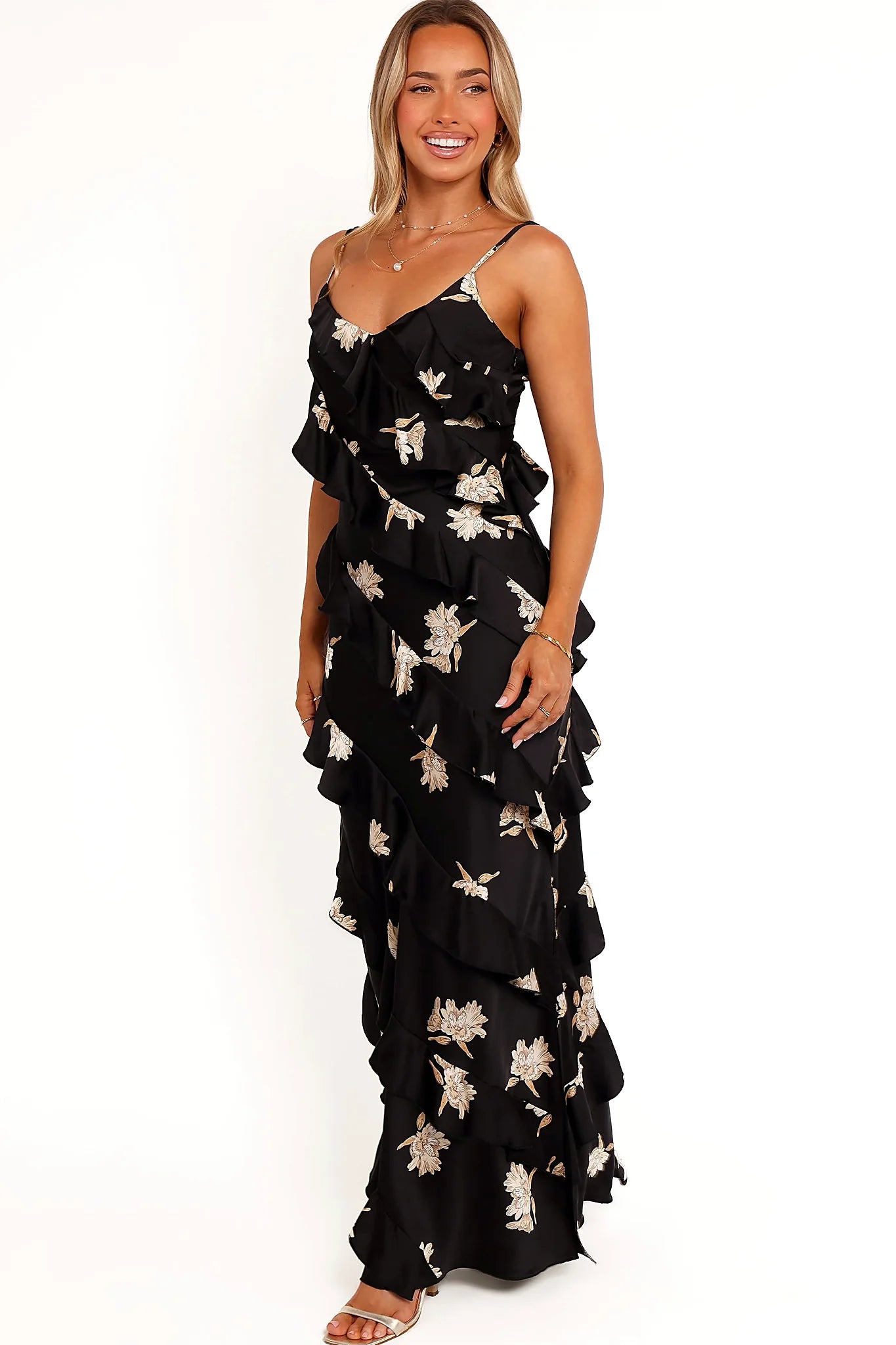Full length view of a black floral satin maxi dress with a side split