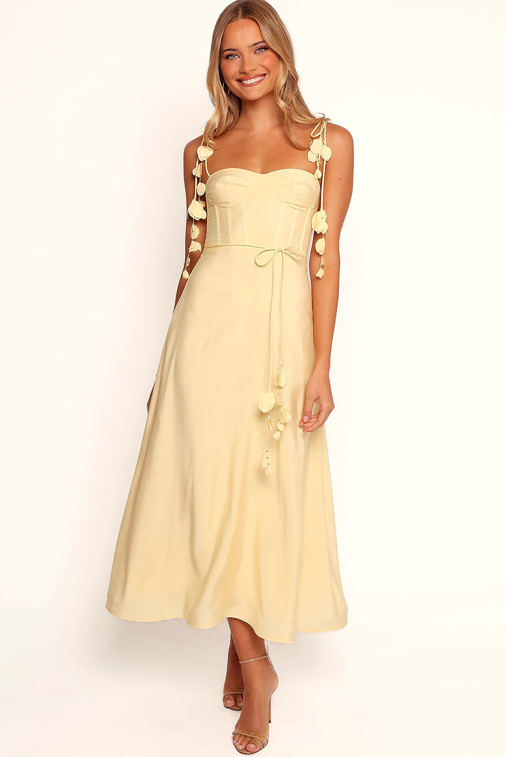 Structured boning in the bodice of a yellow midi dress