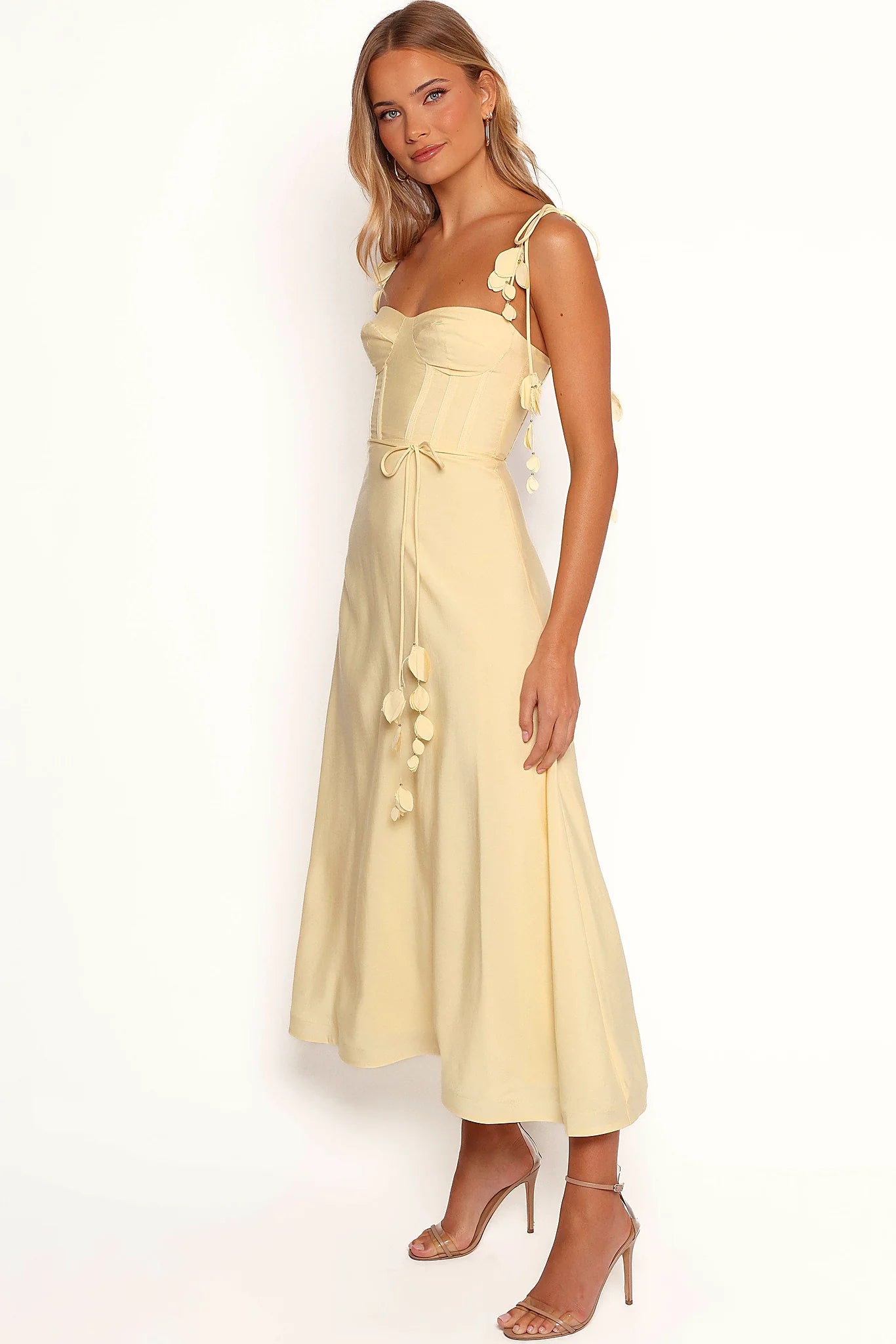 Full length view of a yellow floral design midi dress