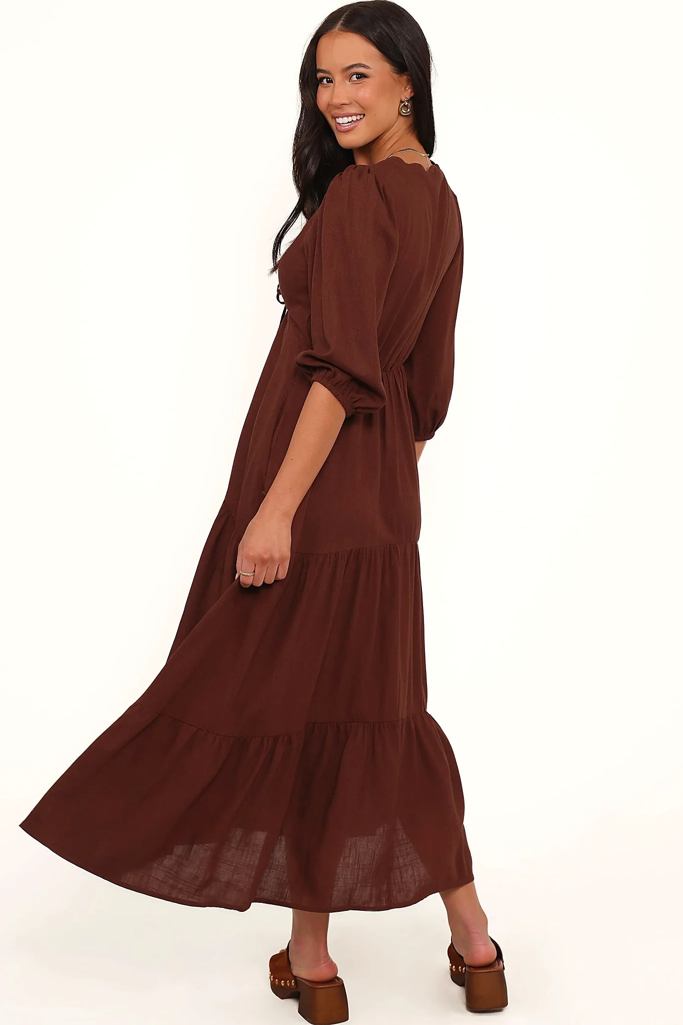 Full length view of a drop tiered chocolate midi dress