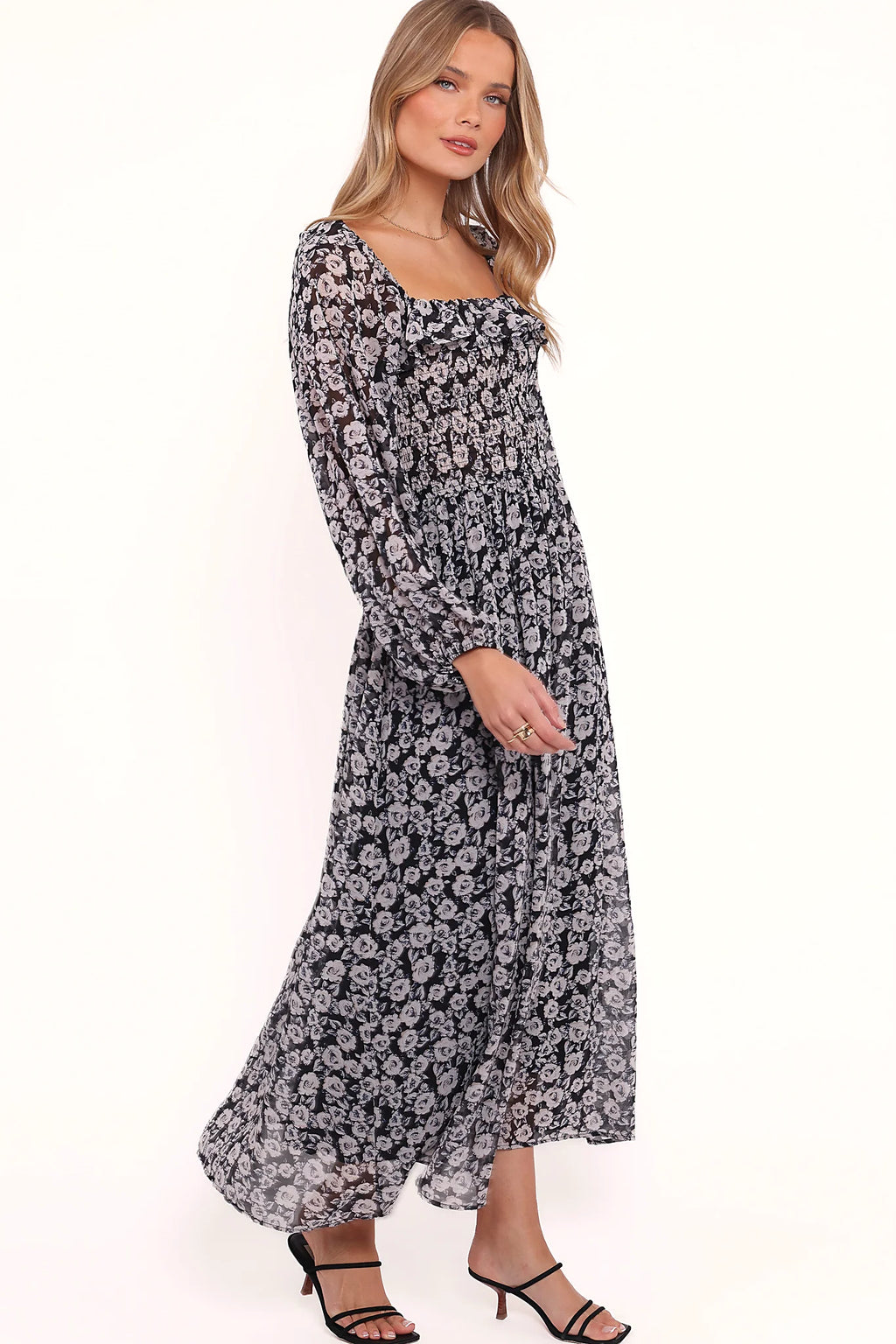 Ruffle detail on a black floral print maxi dress