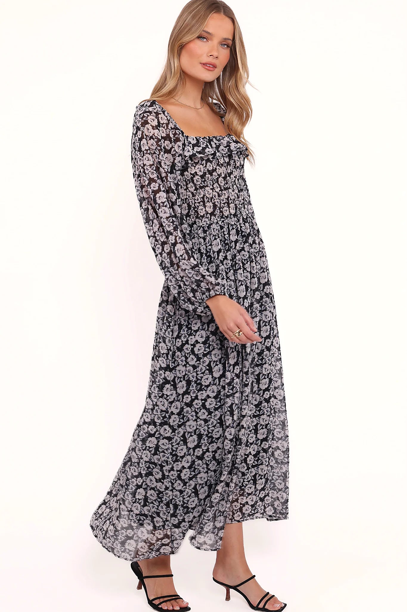 Ruffle detail on a black floral print maxi dress