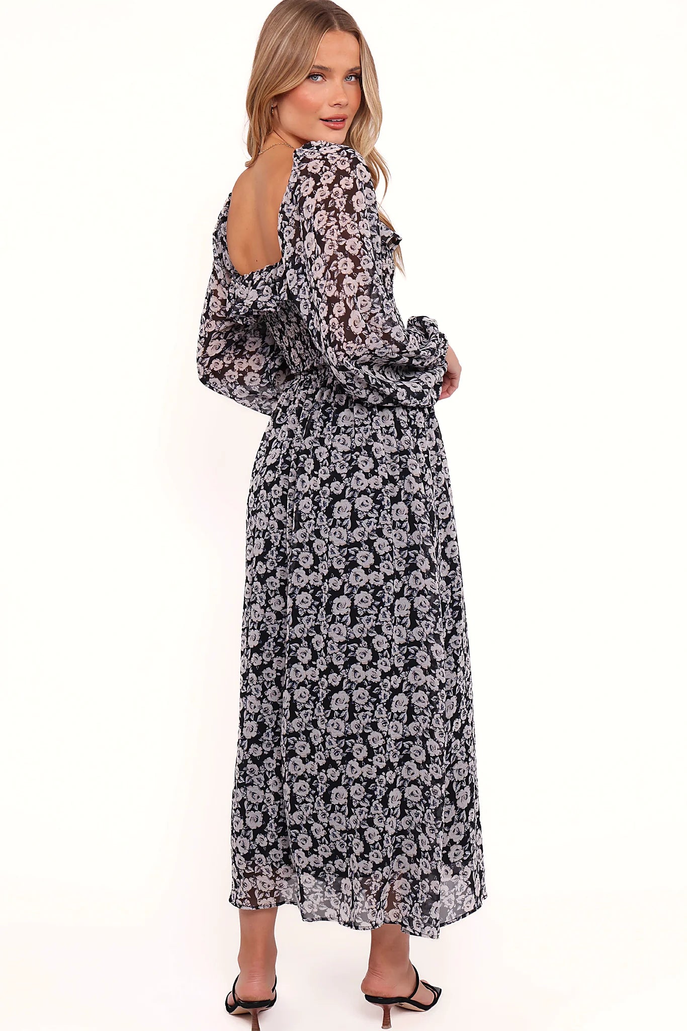 Full length view of a black floral long sleeve maxi dress