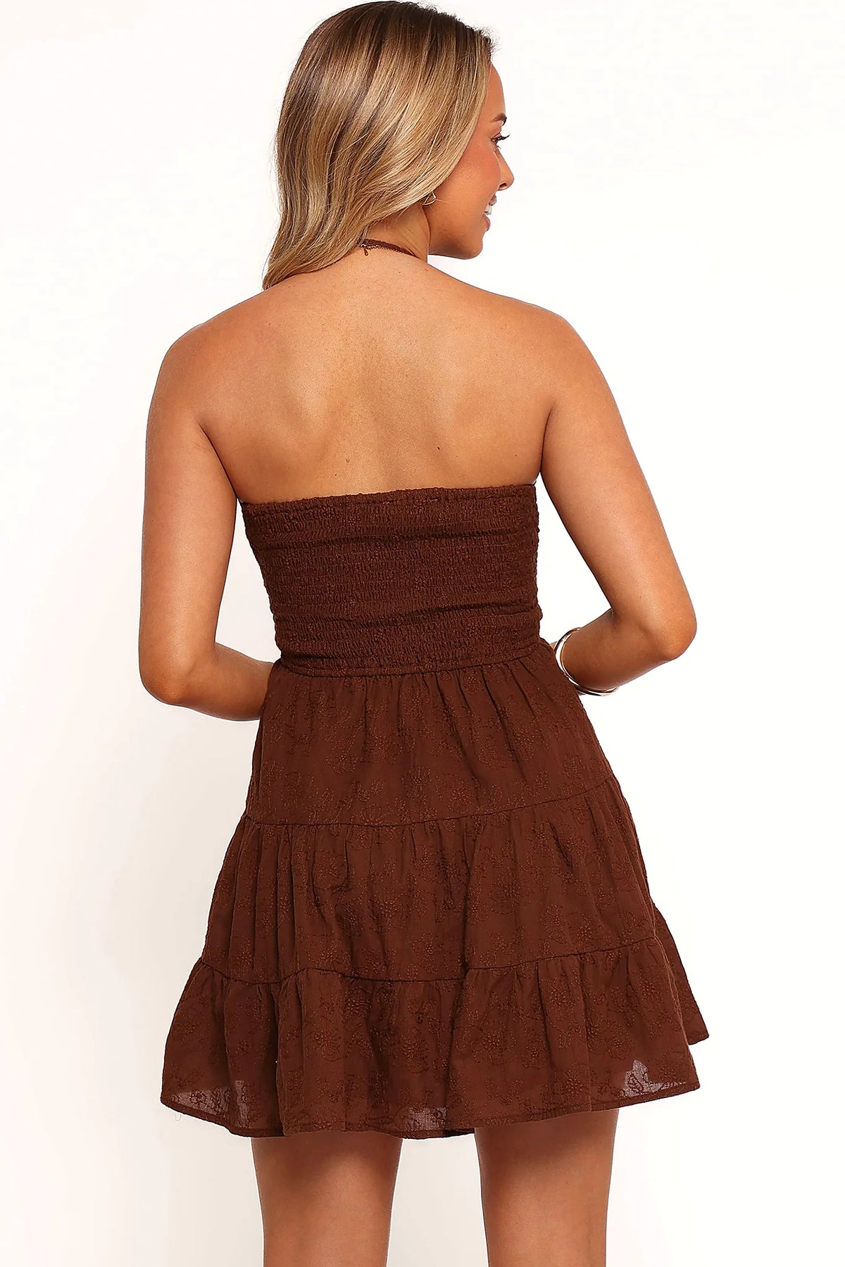 Full view of a brown floral texture mini dress