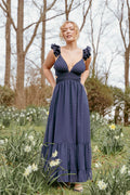 Navy maxi dress with a V neckline and floral embroidery detail