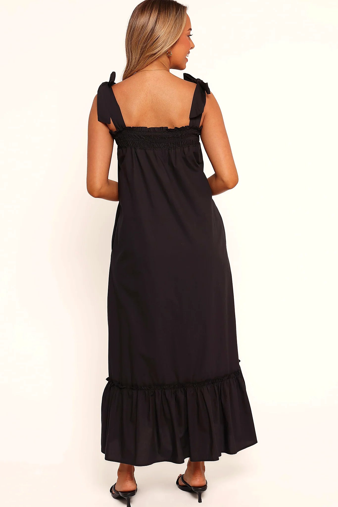Full length view of a black cotton maxi dress with pockets