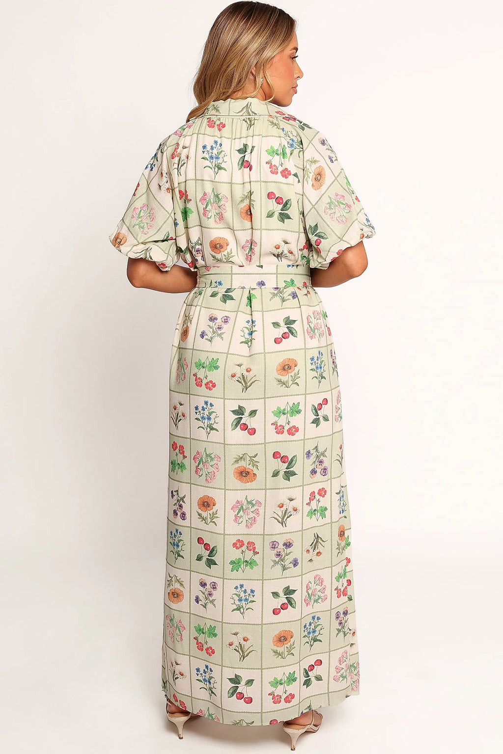 Full length view of a button through floral maxi dress