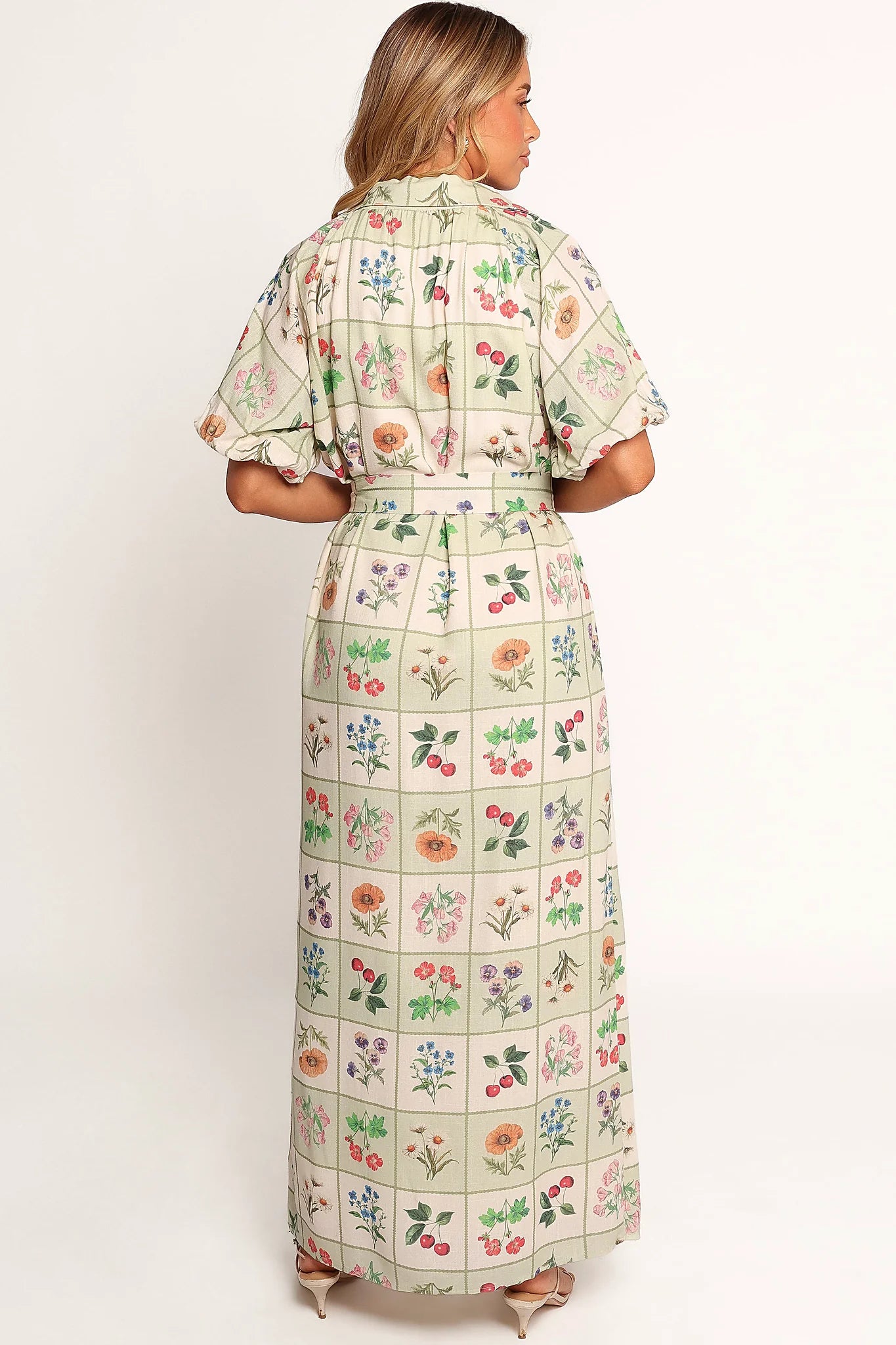 Full length view of a button through floral maxi dress