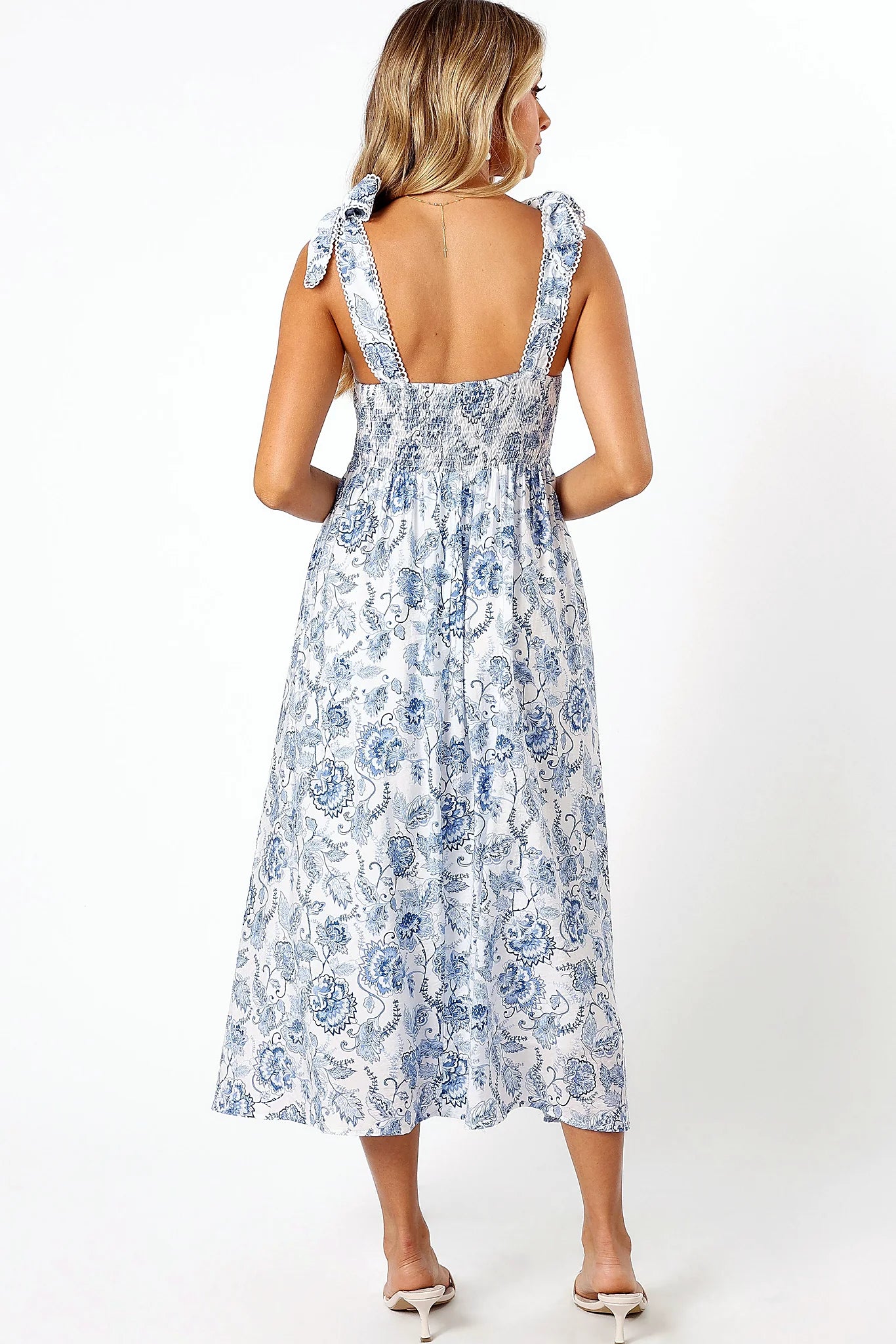 Full length view of a blue floral midi dress