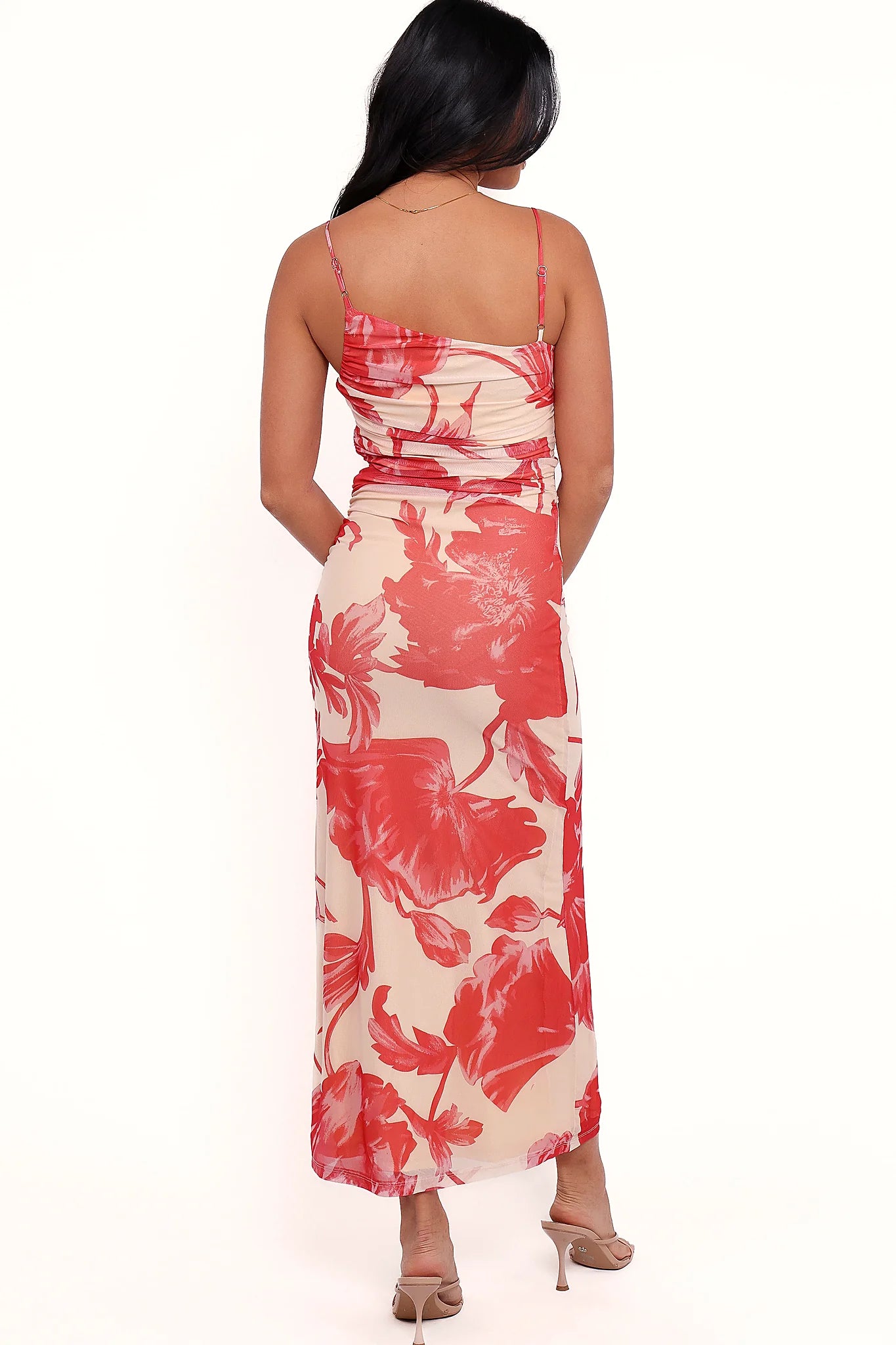 Full length view of a red floral bodycon maxi dress