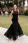 Black maxi dress with a floral lace overlay and boat neckline