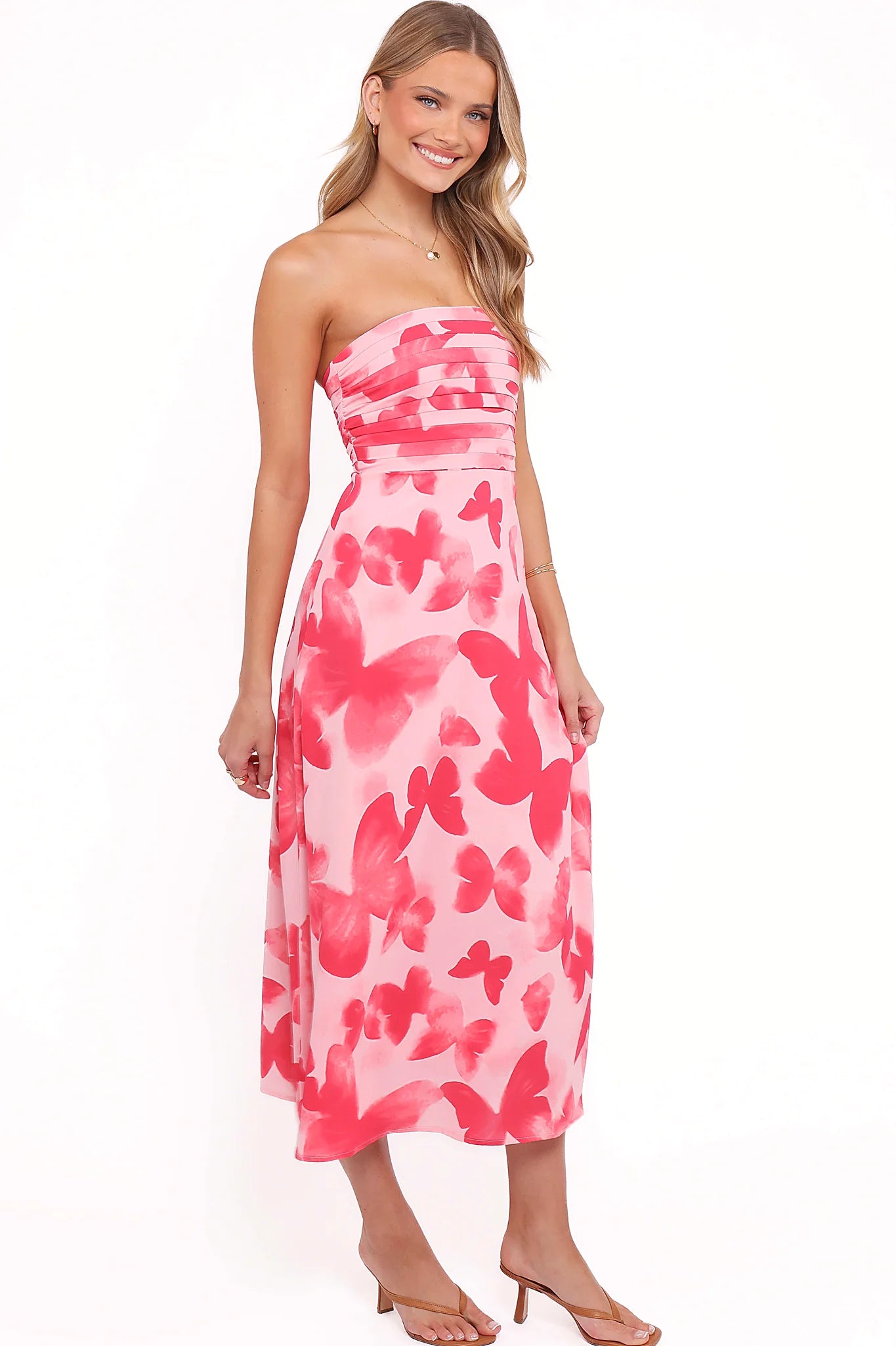 A-line skirt on a strapless butterfly print midi dress