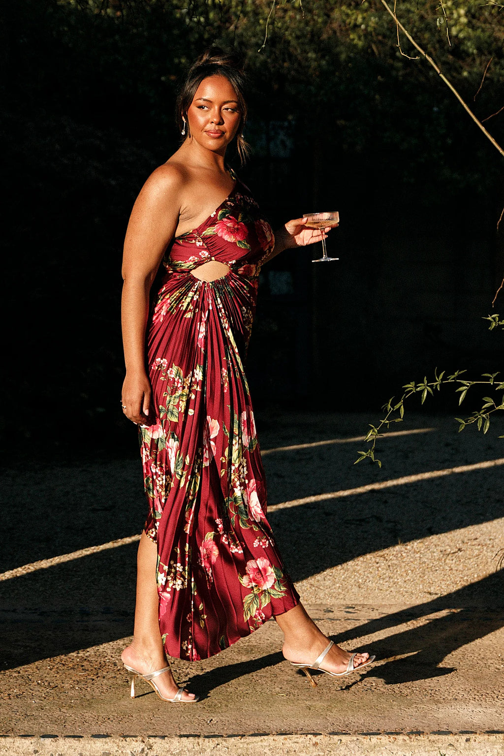 Side elasticised cutout feature on a burgundy floral maxi dress