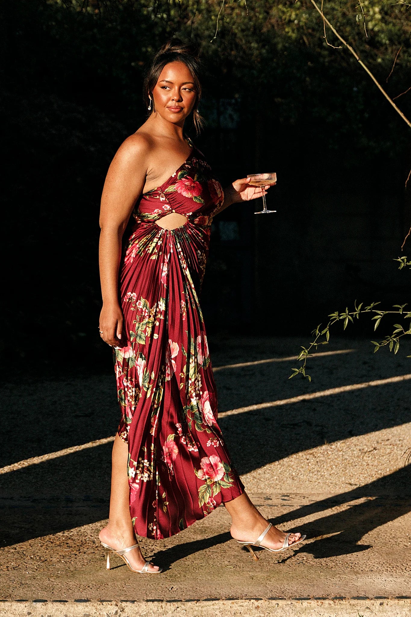 Side elasticised cutout feature on a burgundy floral maxi dress