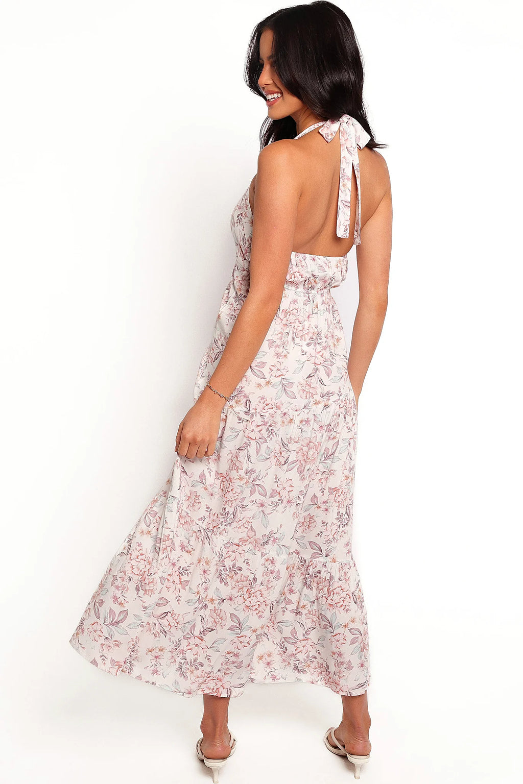 Full length view of a floral halter neck maxi dress