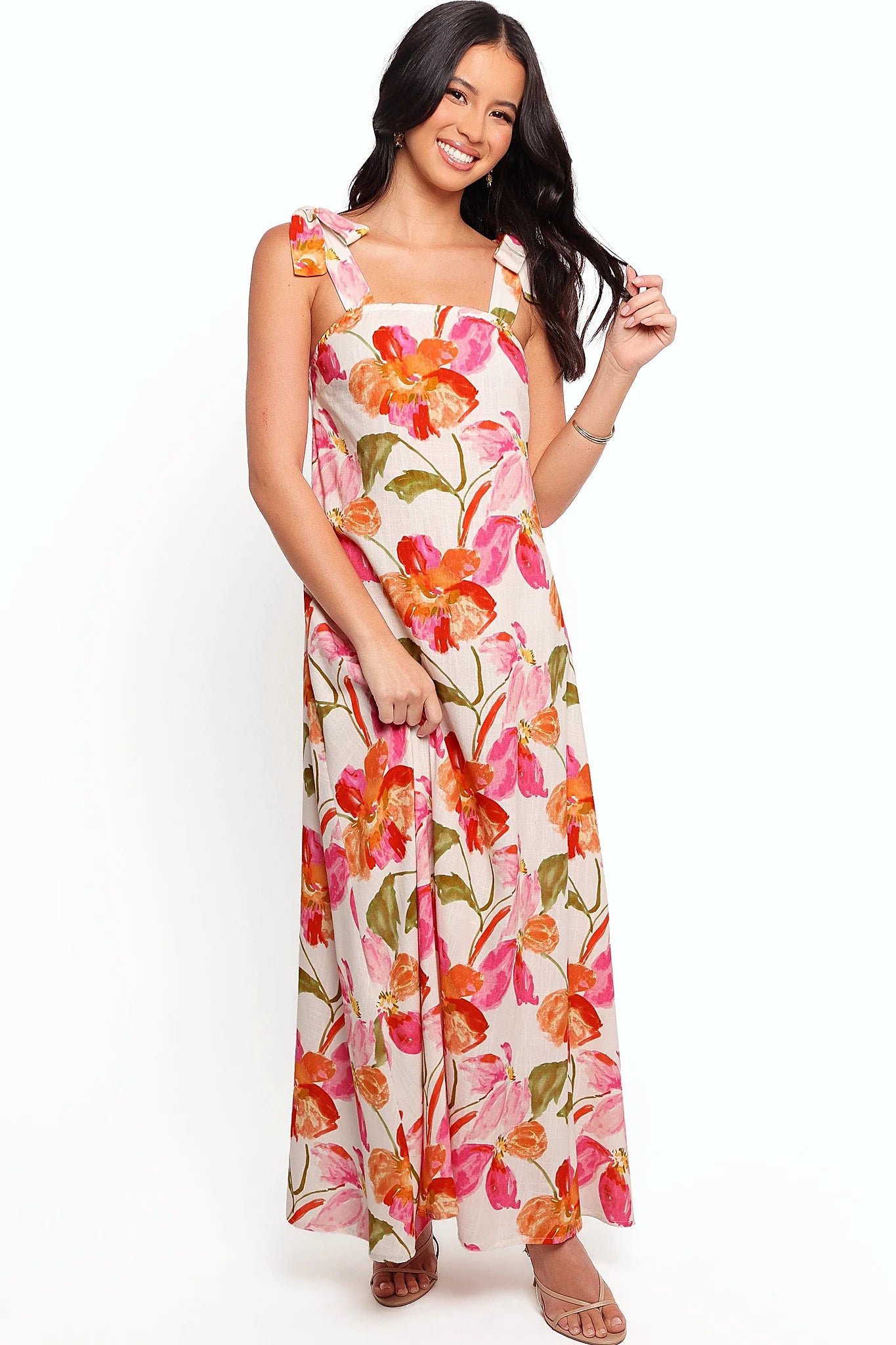 Tie close shoulder straps on a floral linen maxi dress