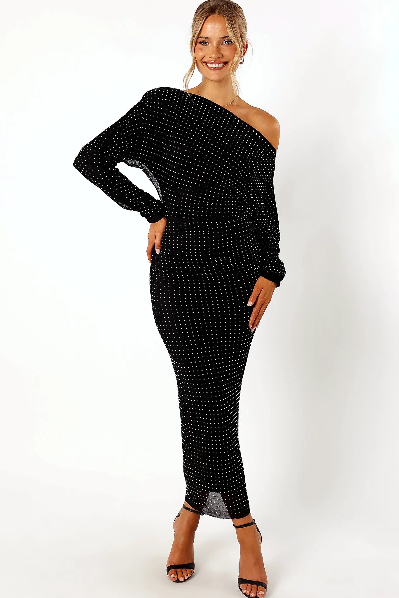 Black midi dress with embellished diamantes and an asymmetric neckline