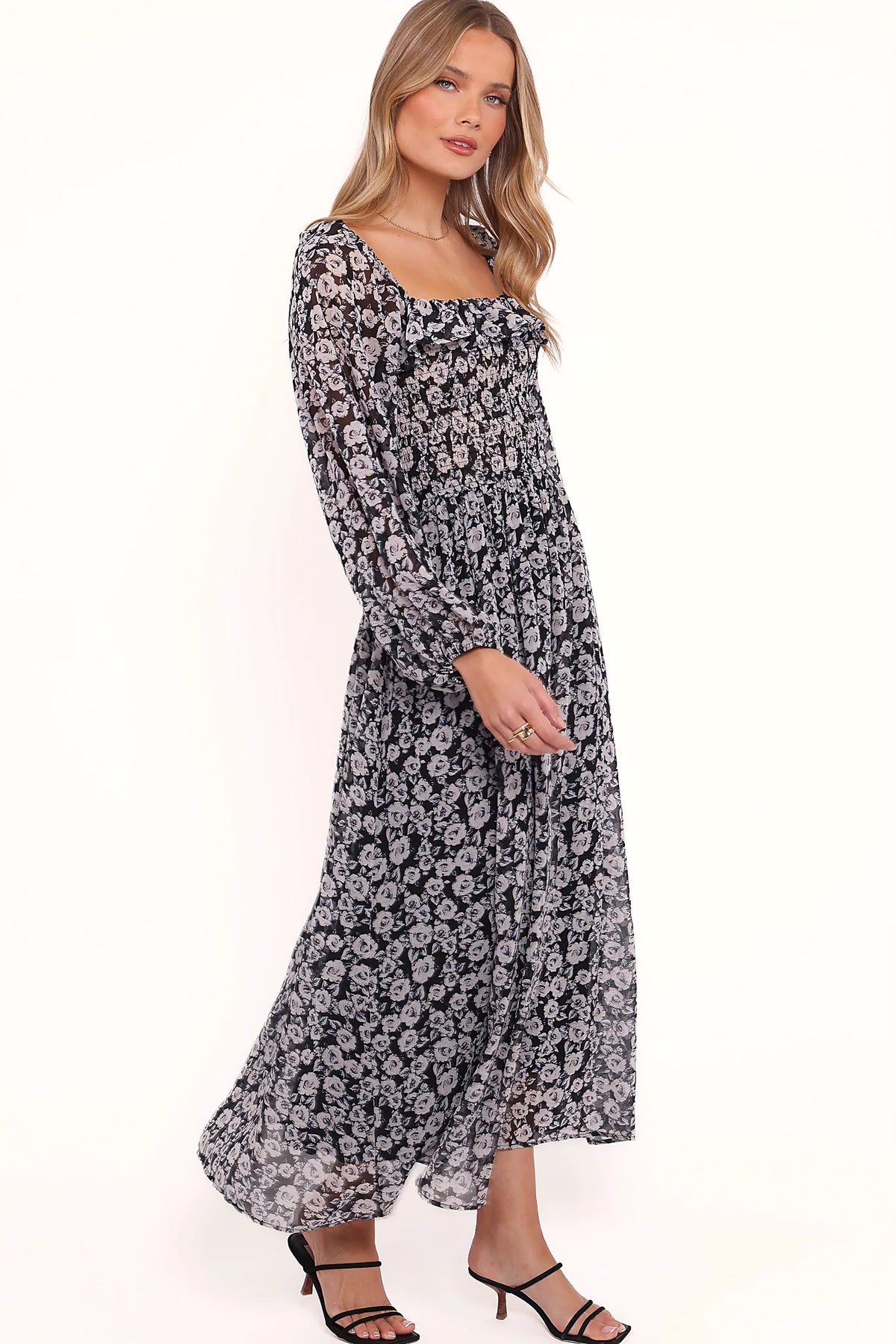 Ruffle detail on a black floral print maxi dress