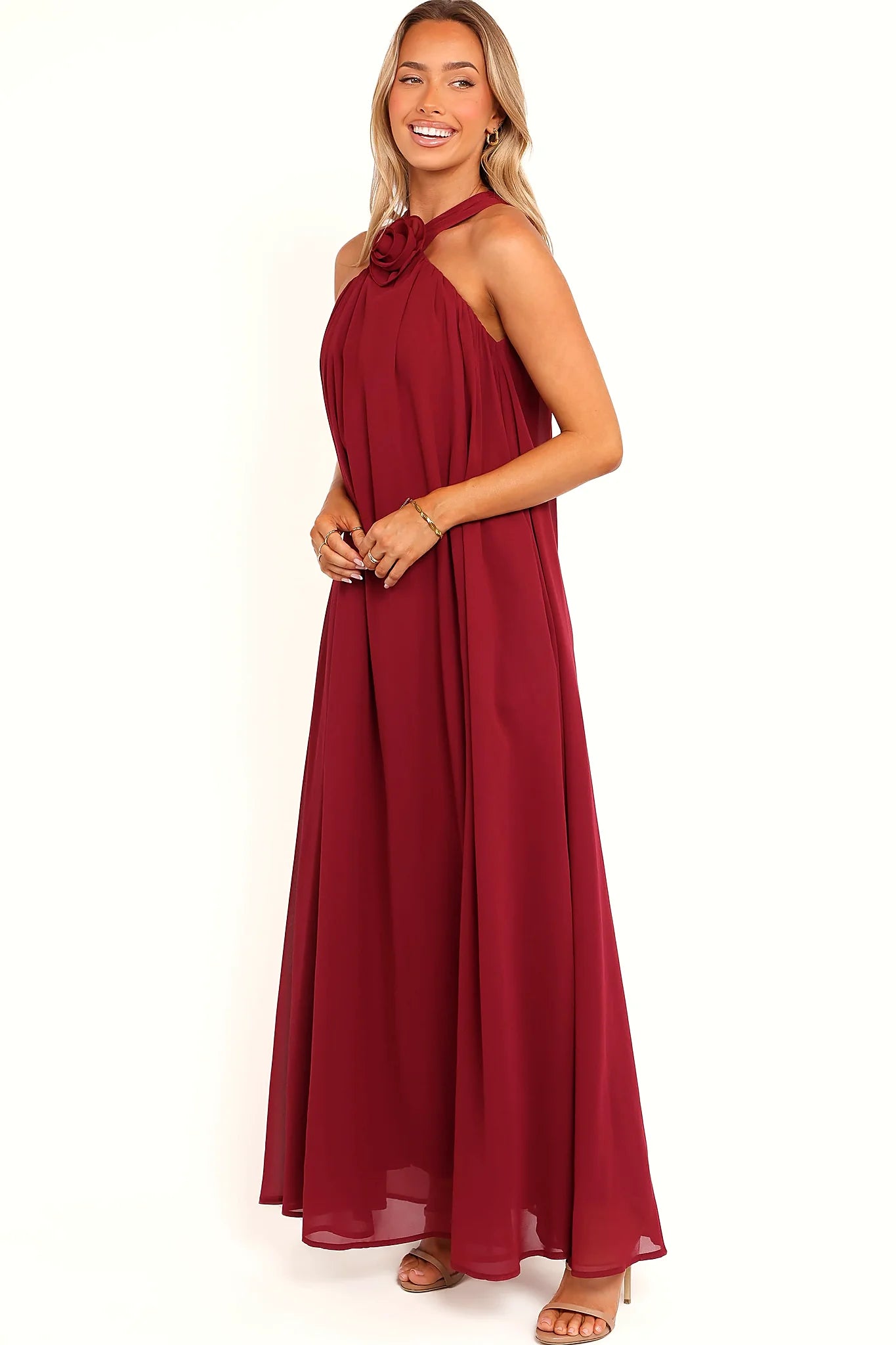 Full length view of a berry halter neck maxi dress