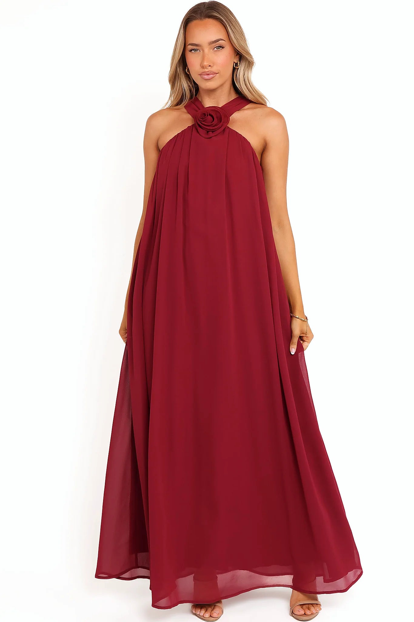 Decorative rosette on the bust of a berry maxi dress