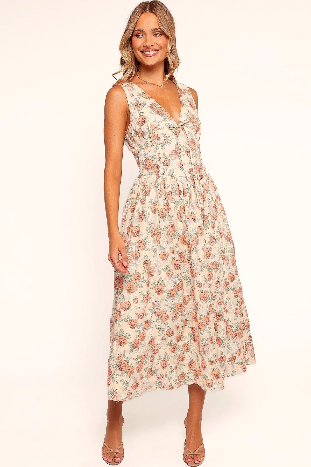 Pink floral midi dress with a V neckline and decorative bust tie