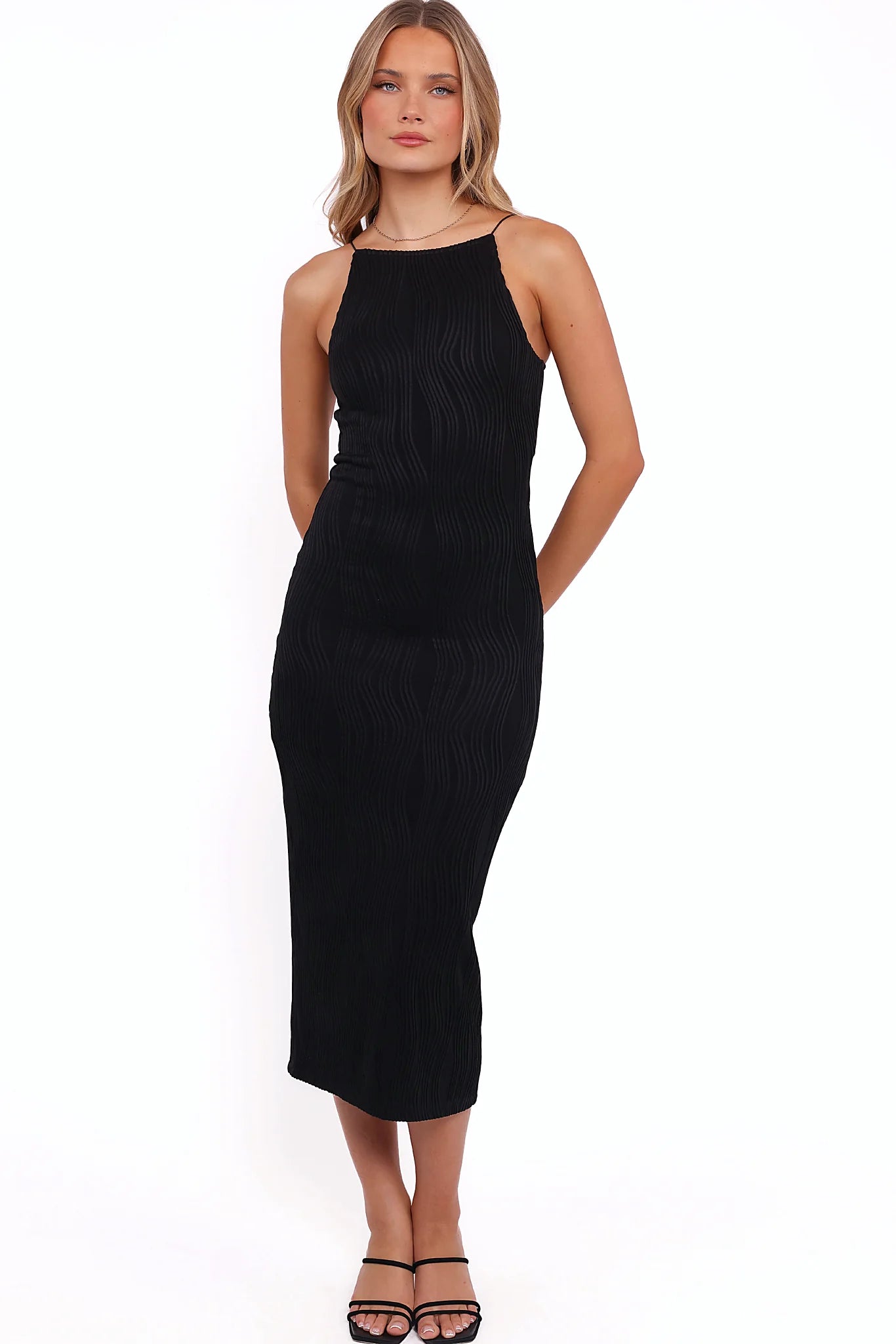 Black bodycon midi dress with a high neckline and thin straps
