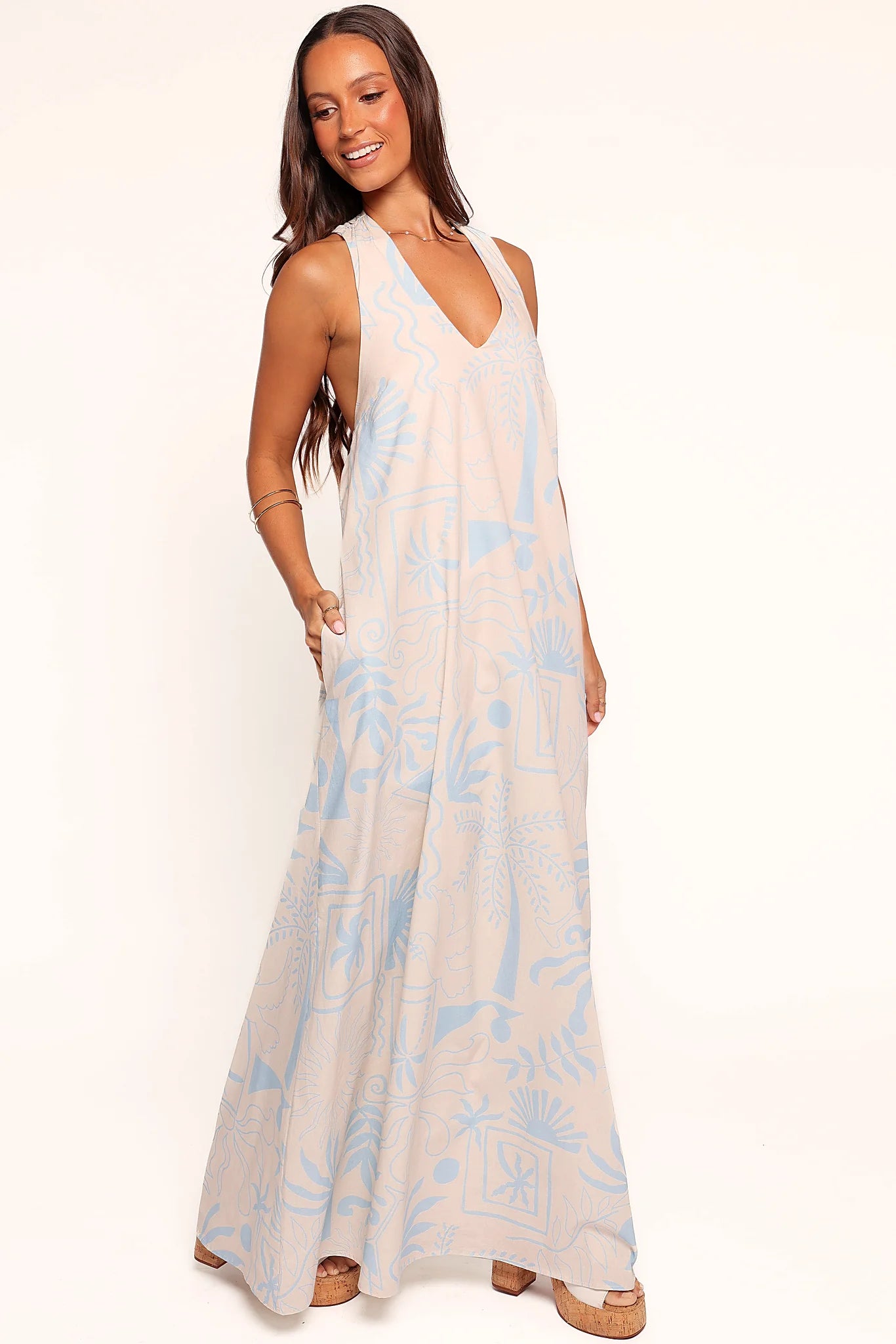 Elasticised waistband at the back of a blue maxi dress