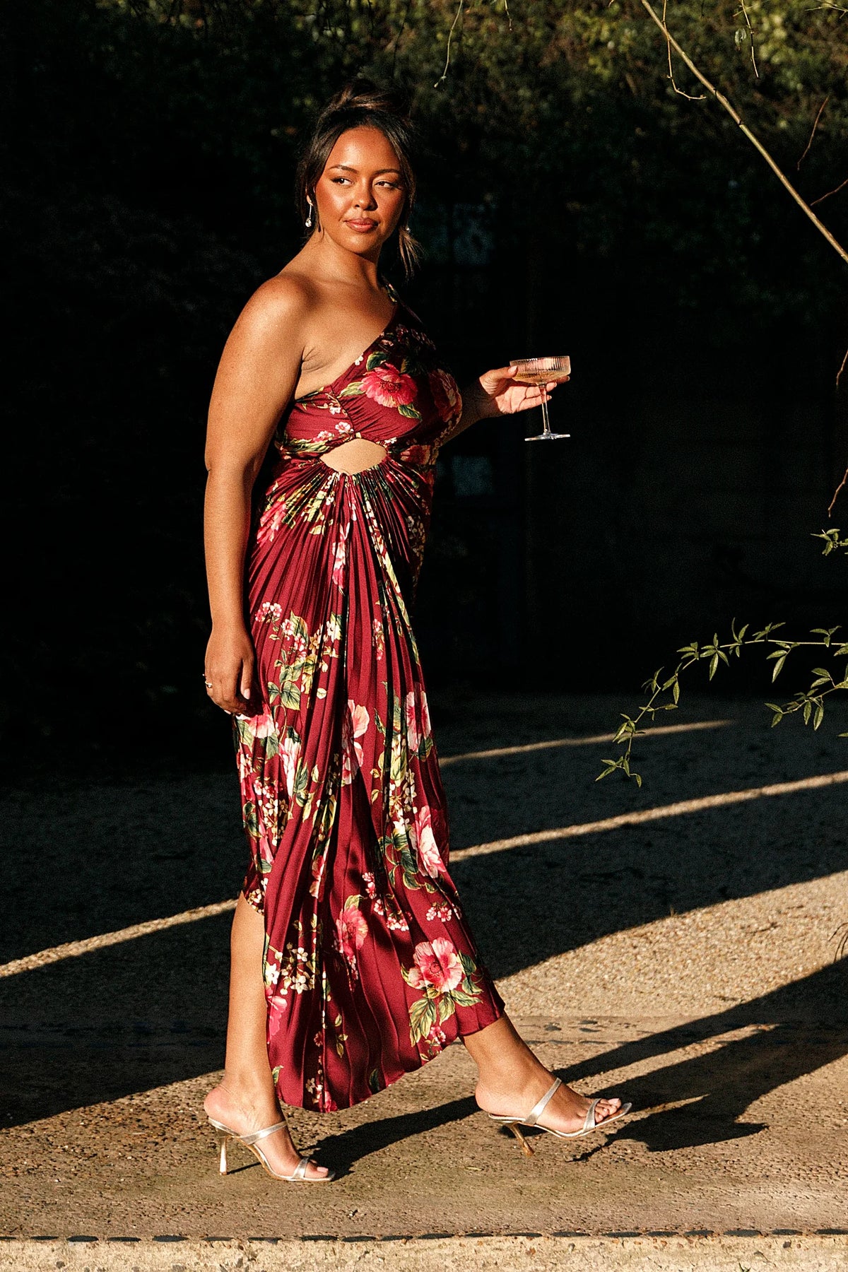 Side elasticised cutout feature on a burgundy floral maxi dress