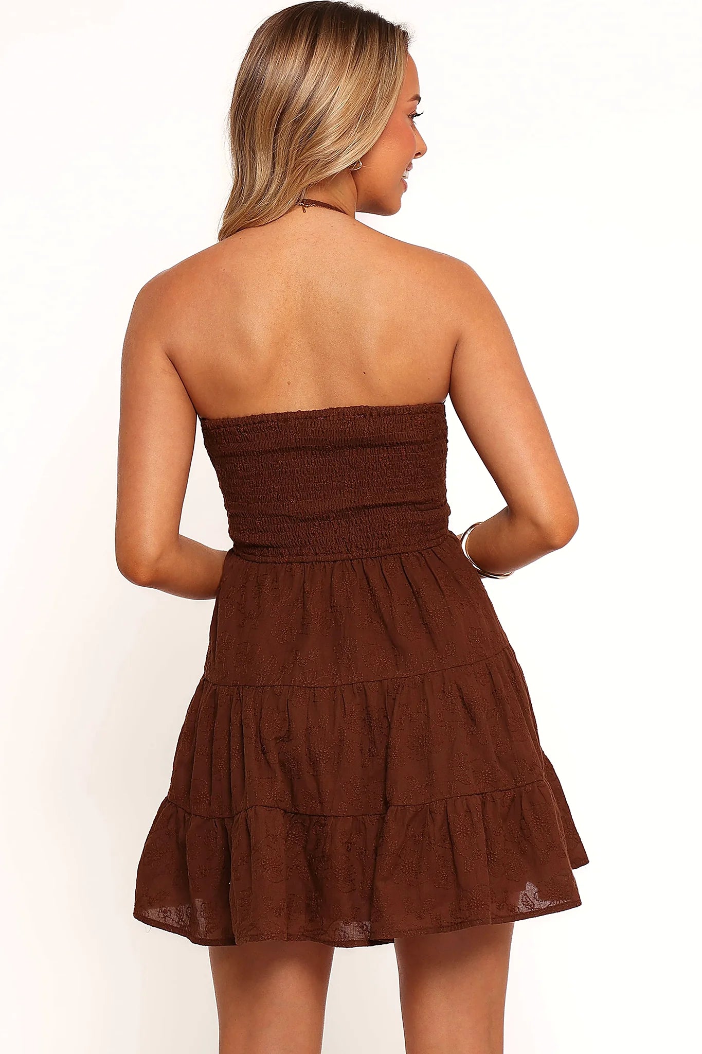 Full view of a brown floral texture mini dress