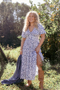 Blue ditsy floral maxi dress with a V neckline and tie close bust