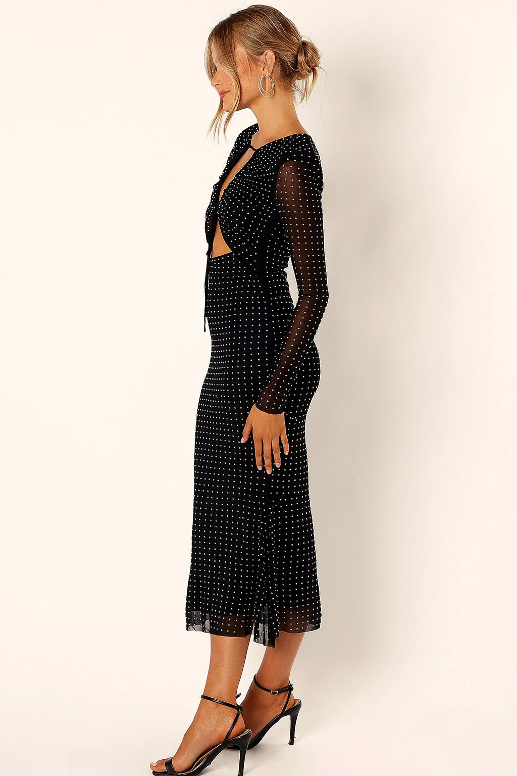 Full length view of a black sequin embroidery midi dress