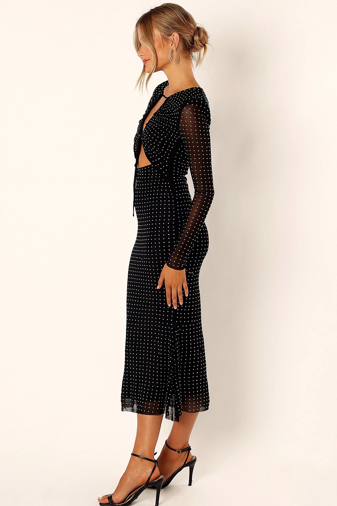 Full length view of a black sequin embroidery midi dress
