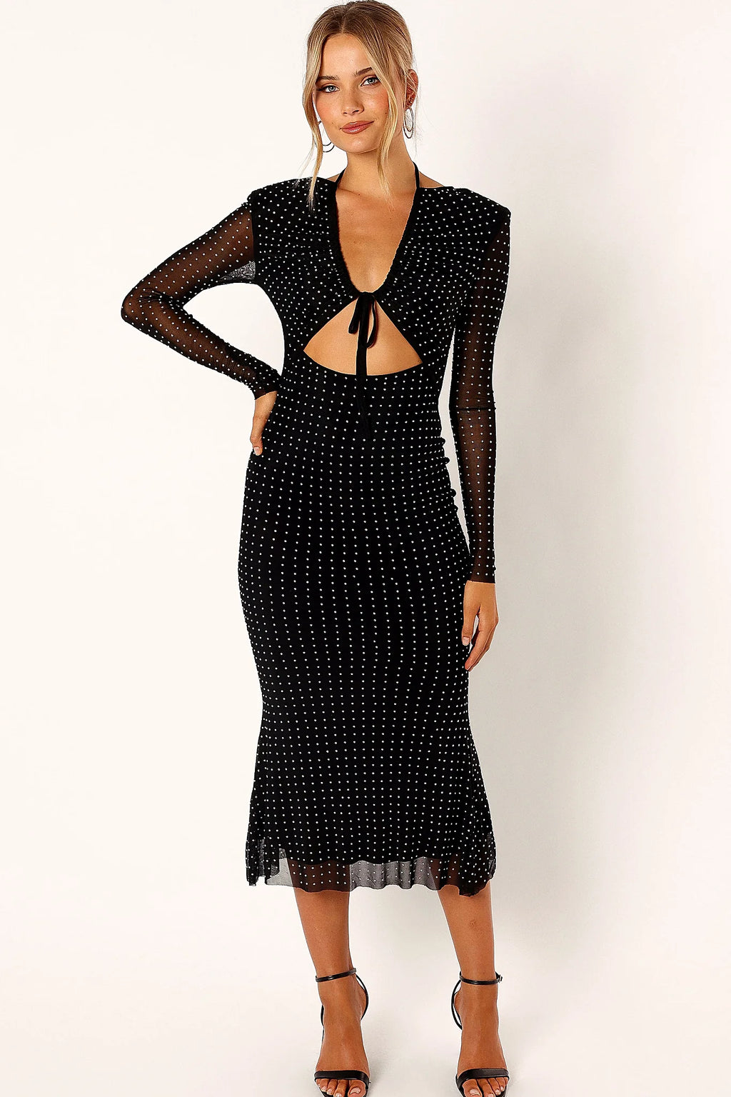 Long mesh sleeve on a black sequin midi dress