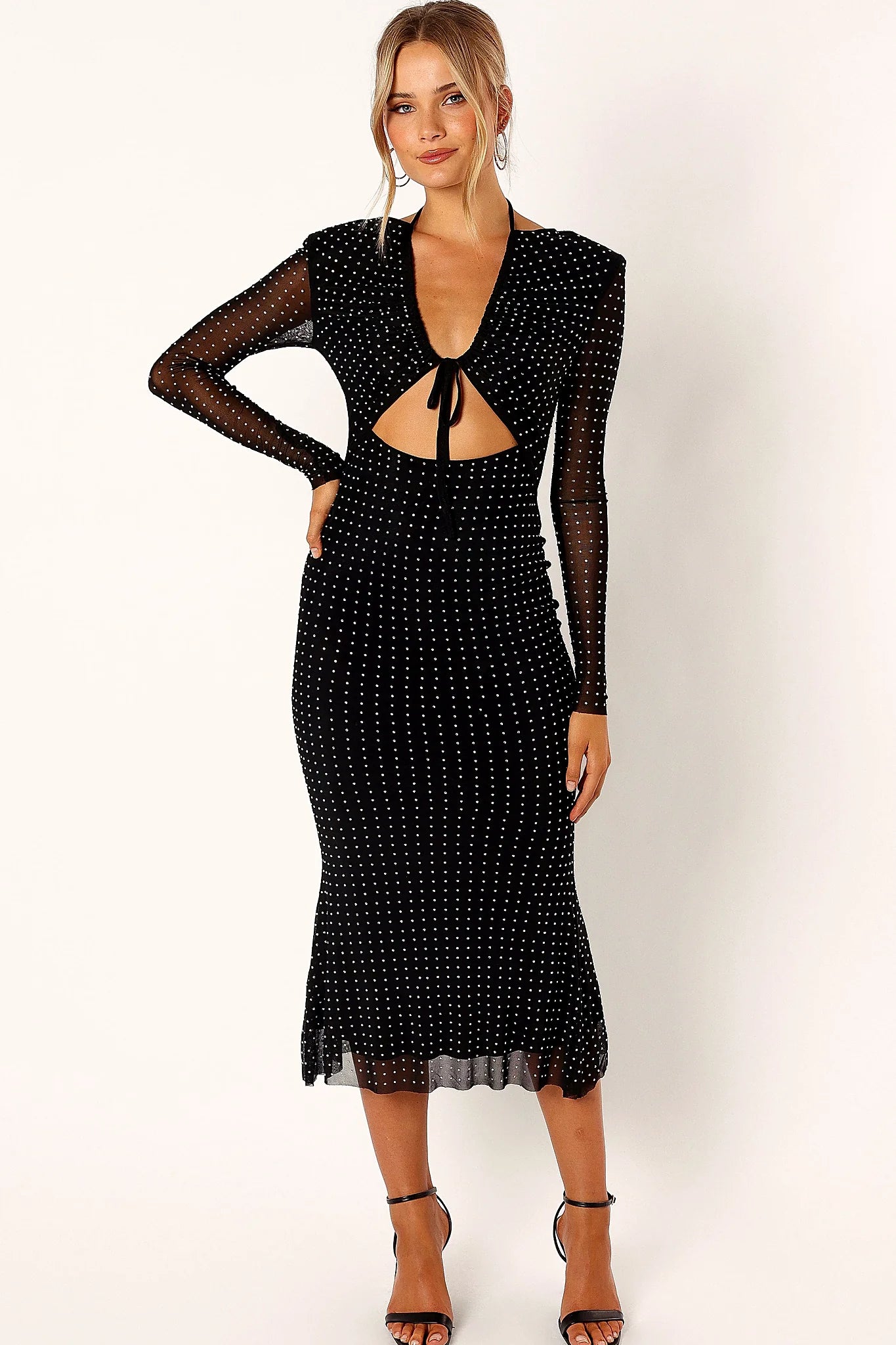 Long mesh sleeve on a black sequin midi dress