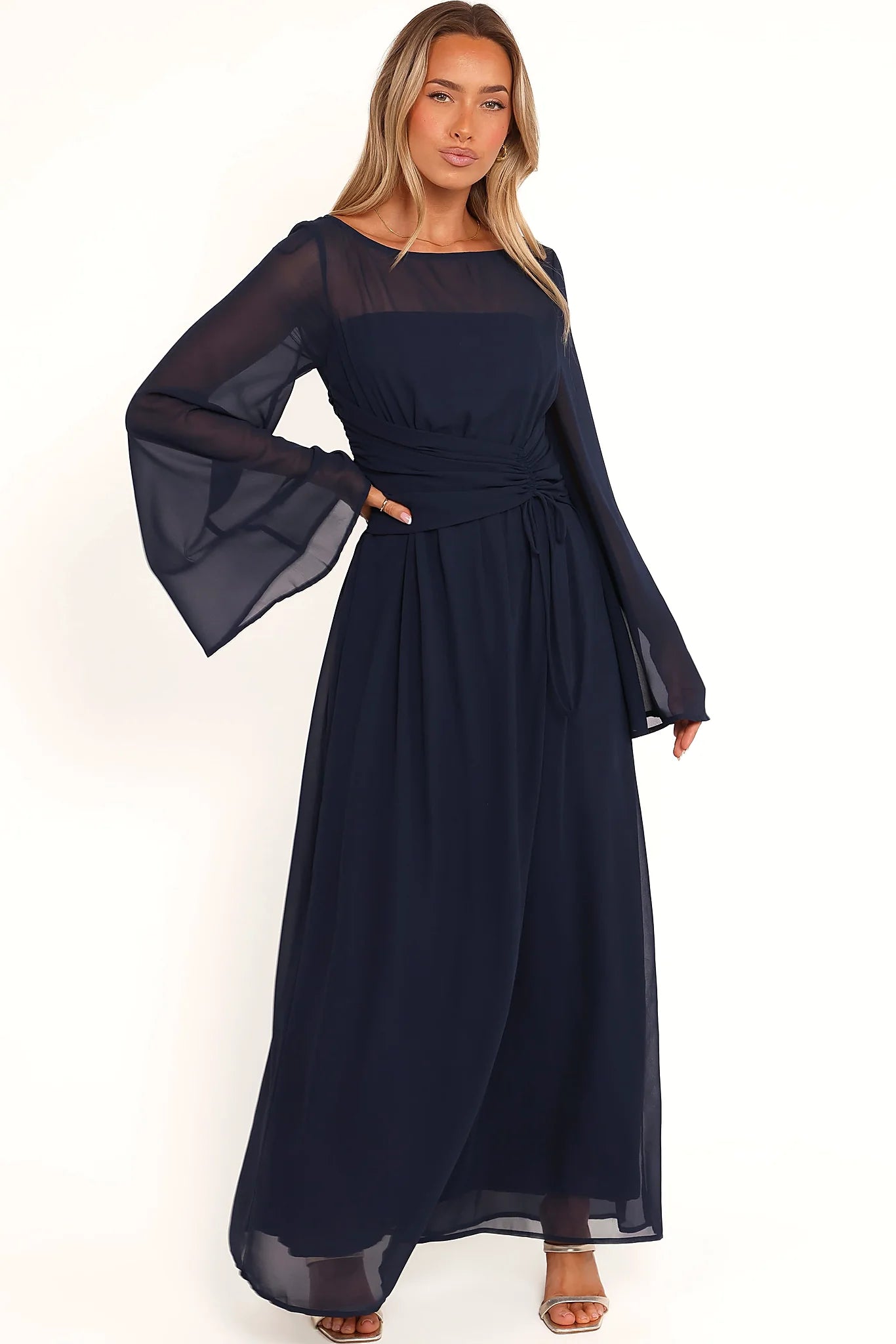 Back neck opening with button close on a navy maxi dress