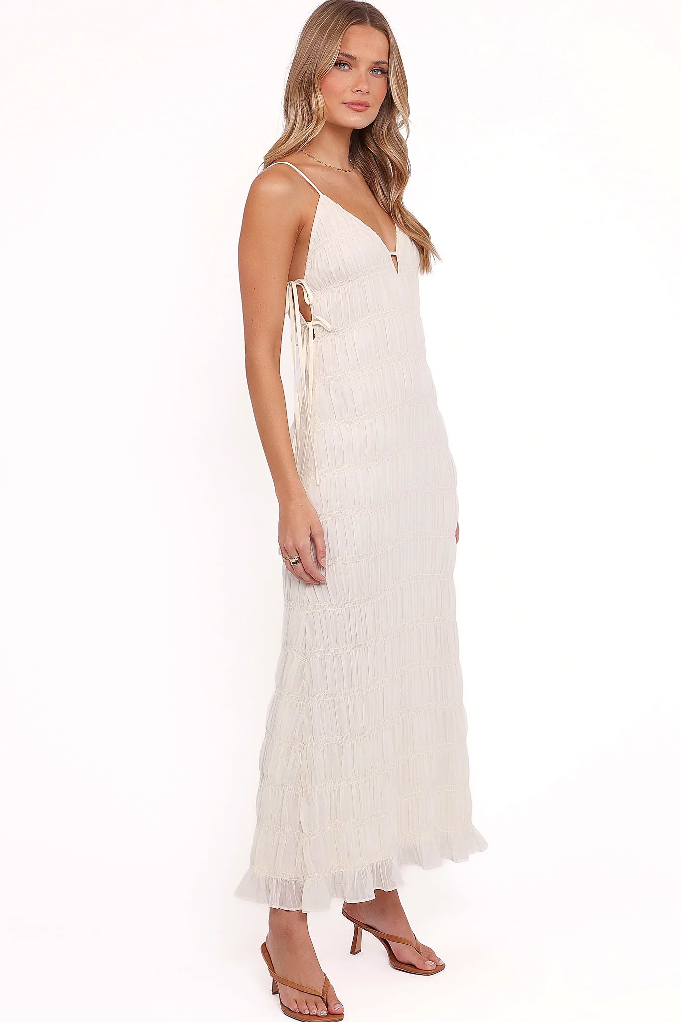 Drop tiered shirred design on a cream midi dress